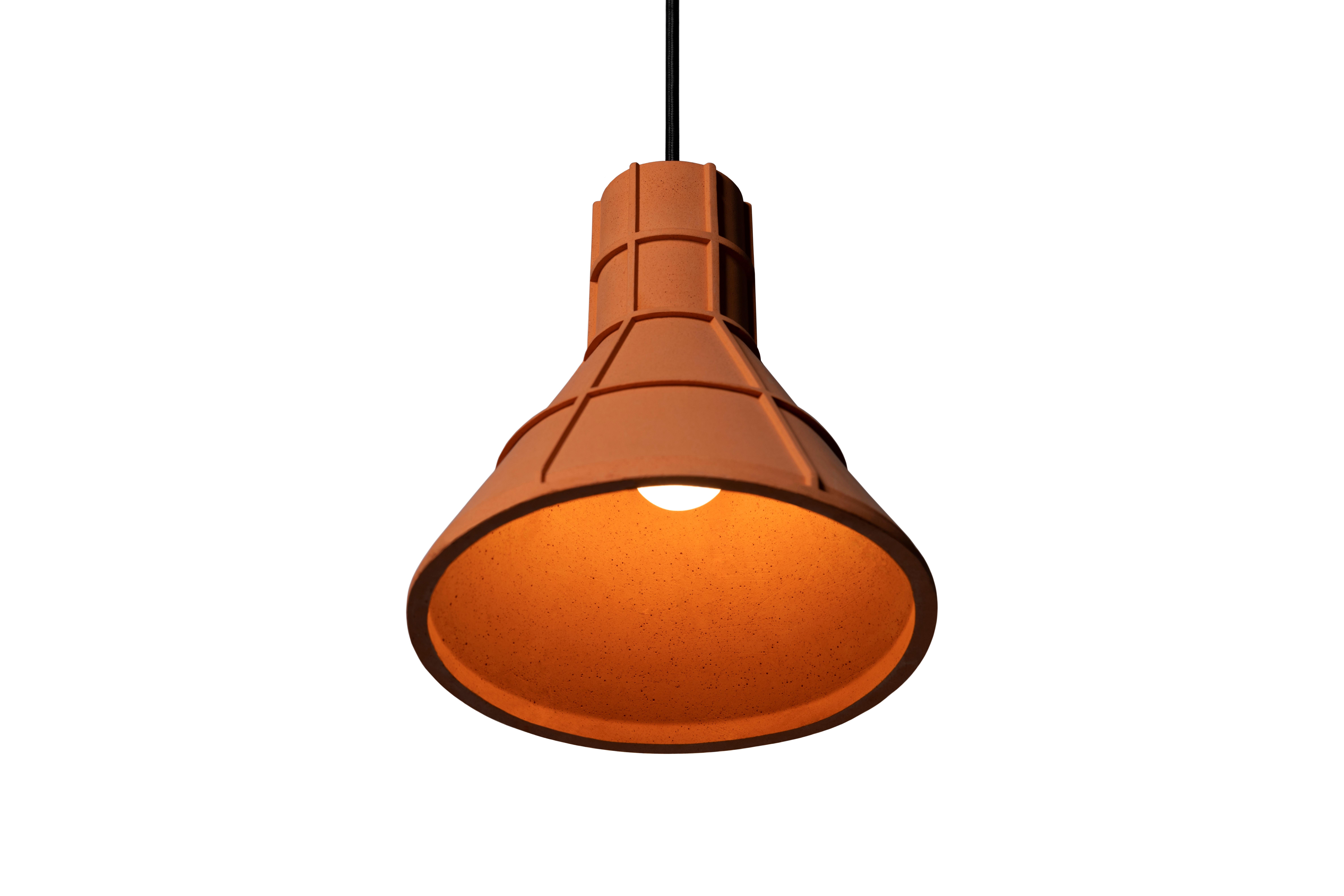 Pendant lamp 'U' by Nongzao x Bentu design.
Material: Terracotta 
Color: earthy orange

Measures: 21.1 cm high, 22.2 cm diameter
Wire: 3 meters (black)
Lamp type: AC 100-240V 50-60Hz  9W - Comptable with US electric system.

Variations:
- Color: