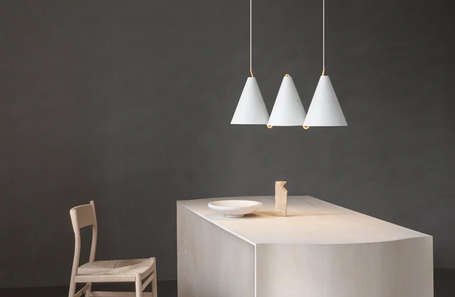 Mosaik, side by side III, pendant lamp in white steel by Lyfa.

Size : H 36,2 x W 79,1 x D 25 cm
Materials: Matt painted steel and Solid brass

Textile wire (white) 300cm

Light source (not included): 
Socket: 3 x E27
Max wattage: 60