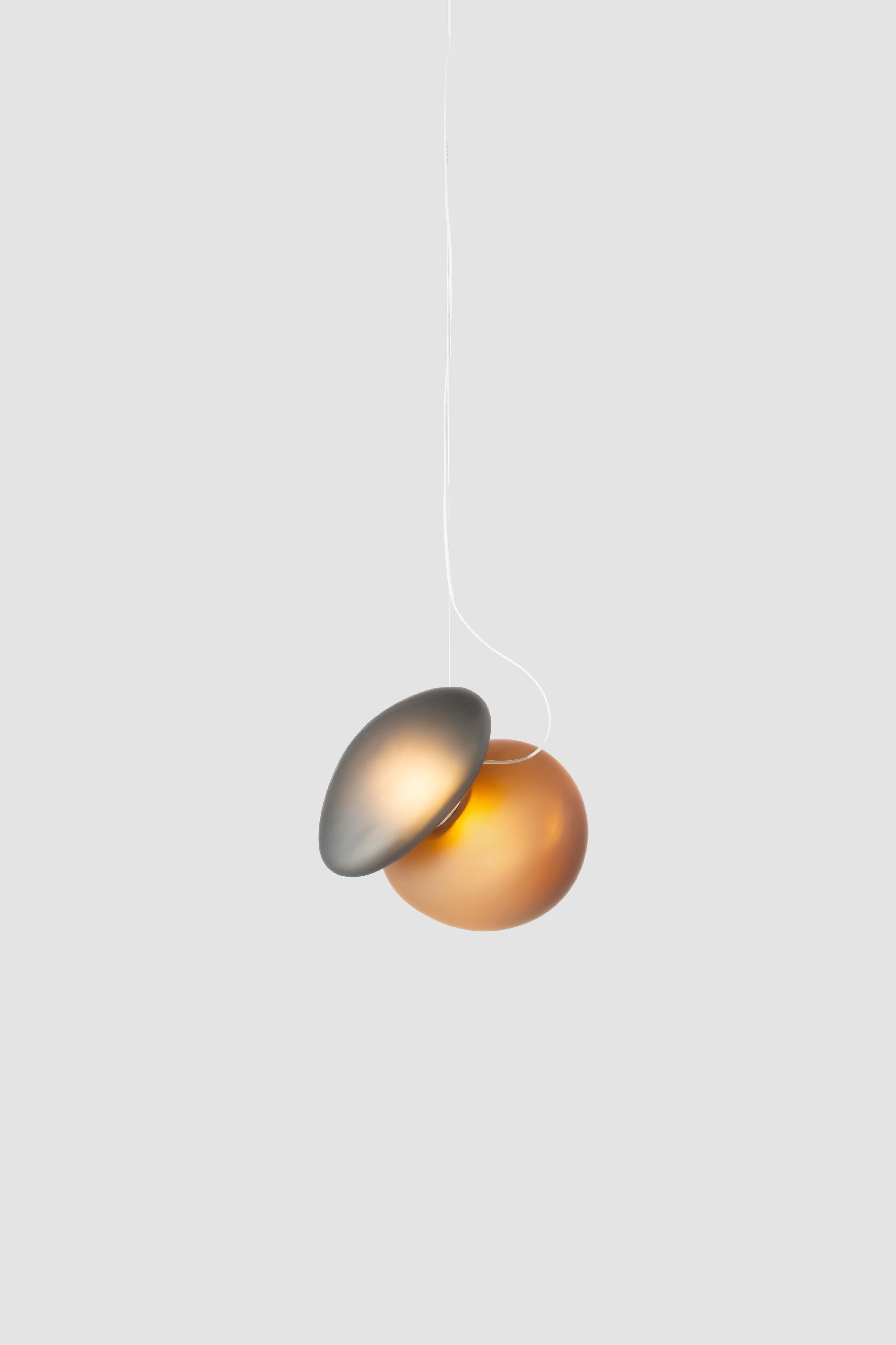 'Pebble' Contemporary pendant lamp 

Model in the picture: 
Color: Shape A (yellow citrine) C (grey slate)
Shapes: A + C

Wire length: 243 cm
Electrical: 14W LED 300ma, 2700K, Dimming: 0–10/ Triac

Available in white pearl, grey slate and
