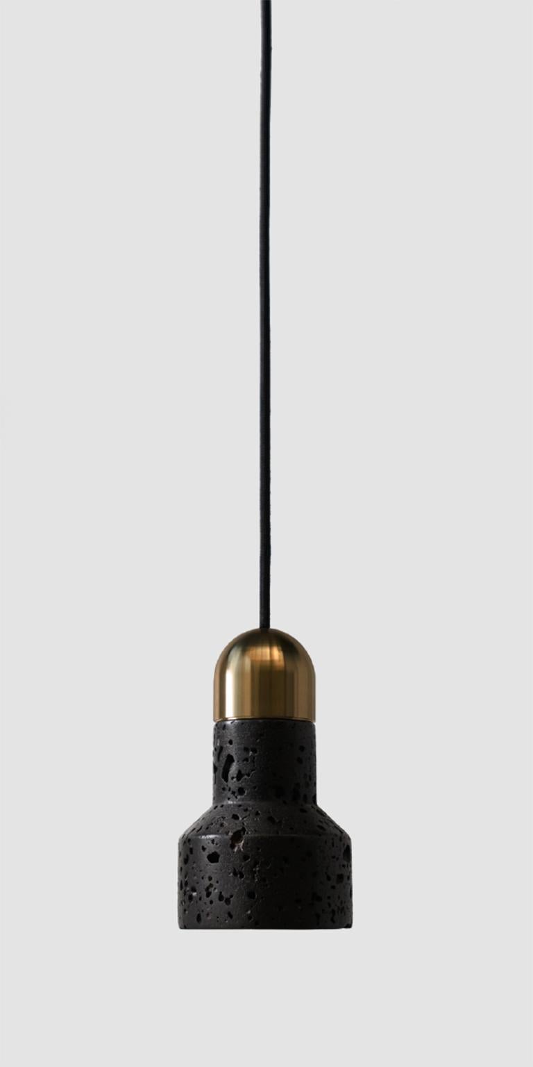 Pendant lamp 'QIE' by Buzao x Bentu Design. 
After concrete version, let's meet the black lava stone and white marble version version!

(Sold individually)

16 cm High; 9,6 cm Length
Wire: 2Meters Black (adjustable)

Brass (gold) or aluminum (black)