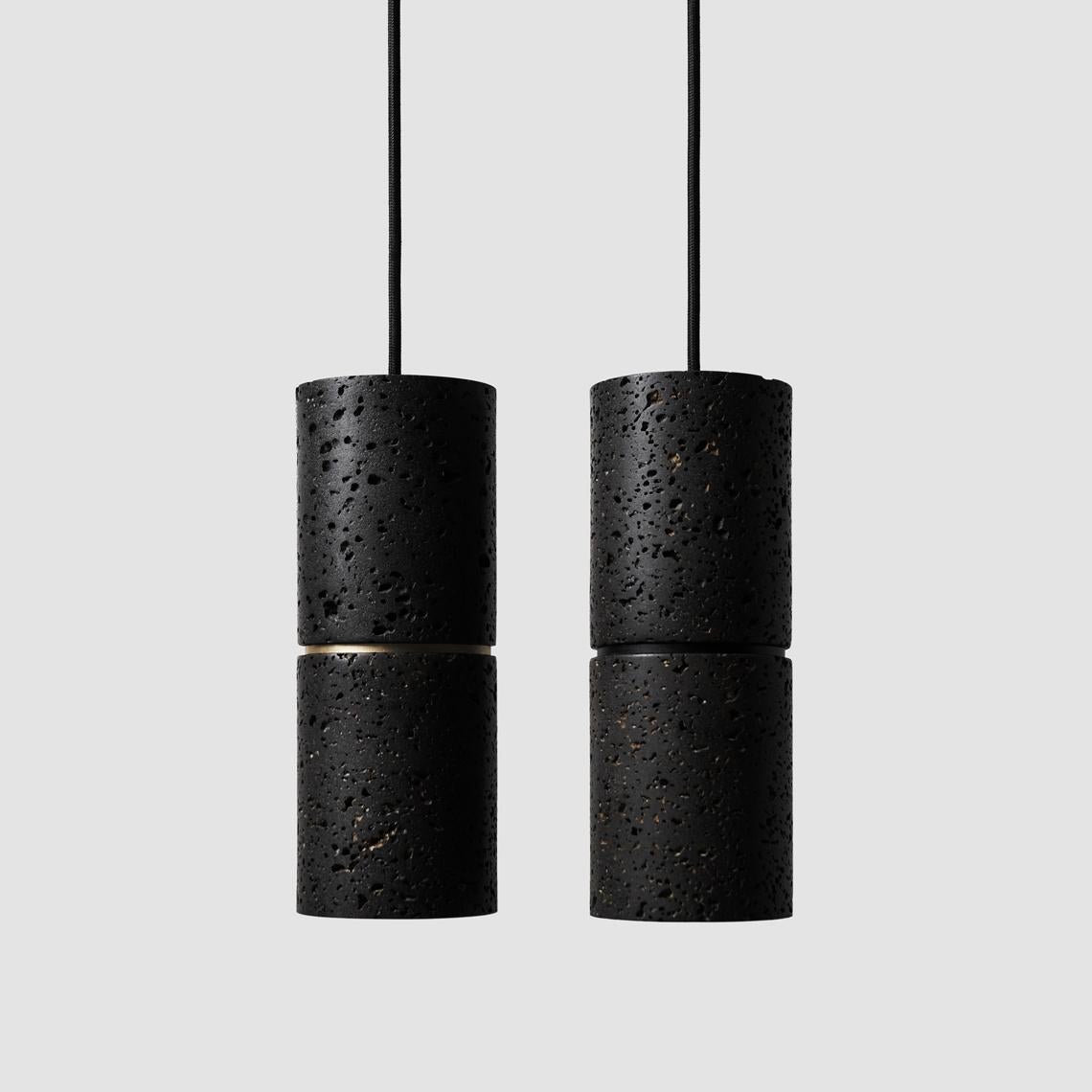 Pendant lamp 'RI' by Buzao x Bentu Design. 
Black lava stone and white marble versions available.

(Sold individually)

26,5 cm high; 10 cm Diameter
Wire: 2 meters black (adjustable)

Brass (gold) or aluminum (black) finish.

Lamp type: E27 LED 3W