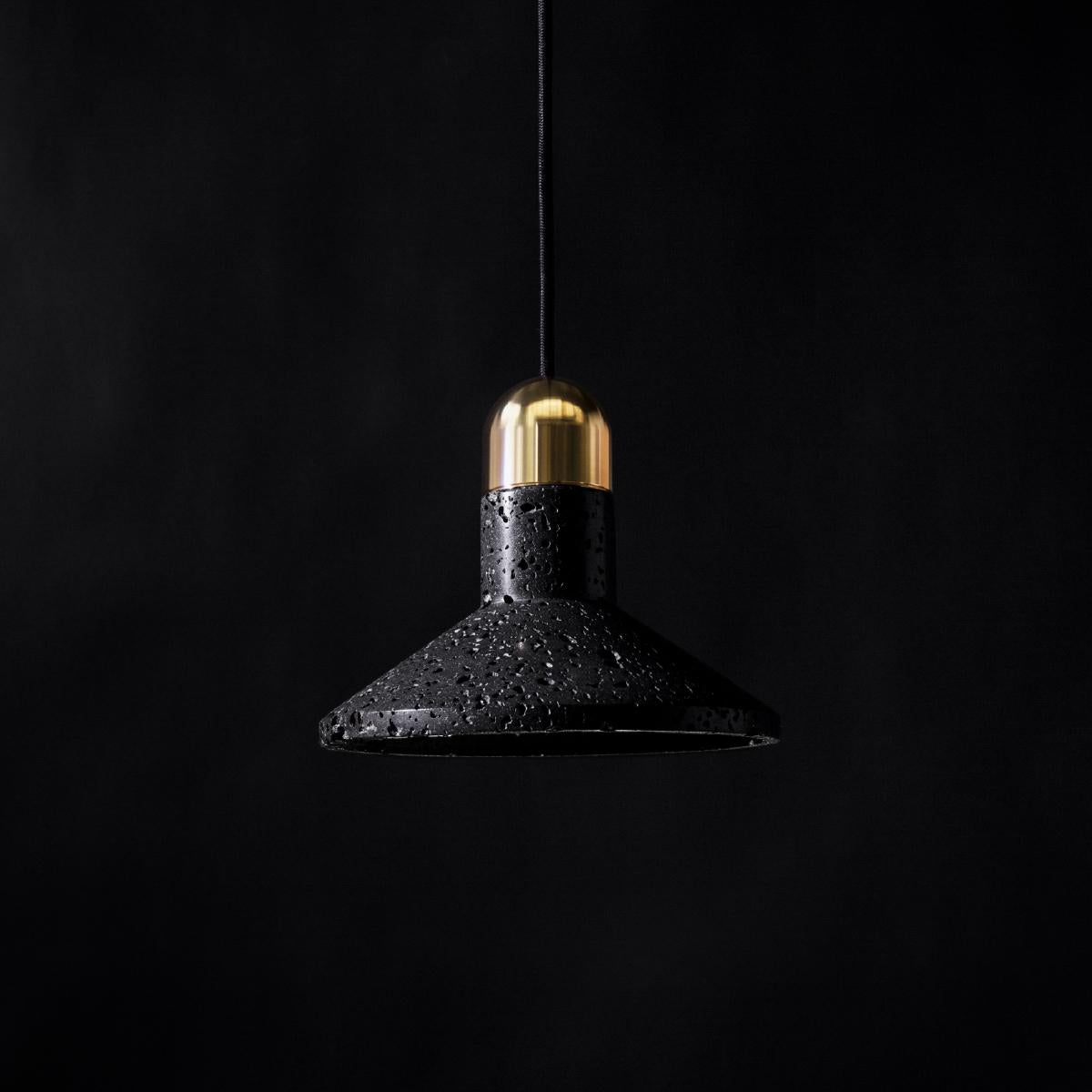 Pendant lamp 'Shang' by Buzao x Bentu Design. 
After concrete version, let's meet the black lava stone version!

(Sold individually)

16 cm High; 20 cm Length
Wire: 2Meters Black (adjustable)

Brass (gold) or aluminum (black) finish.

Lamp Type: E27