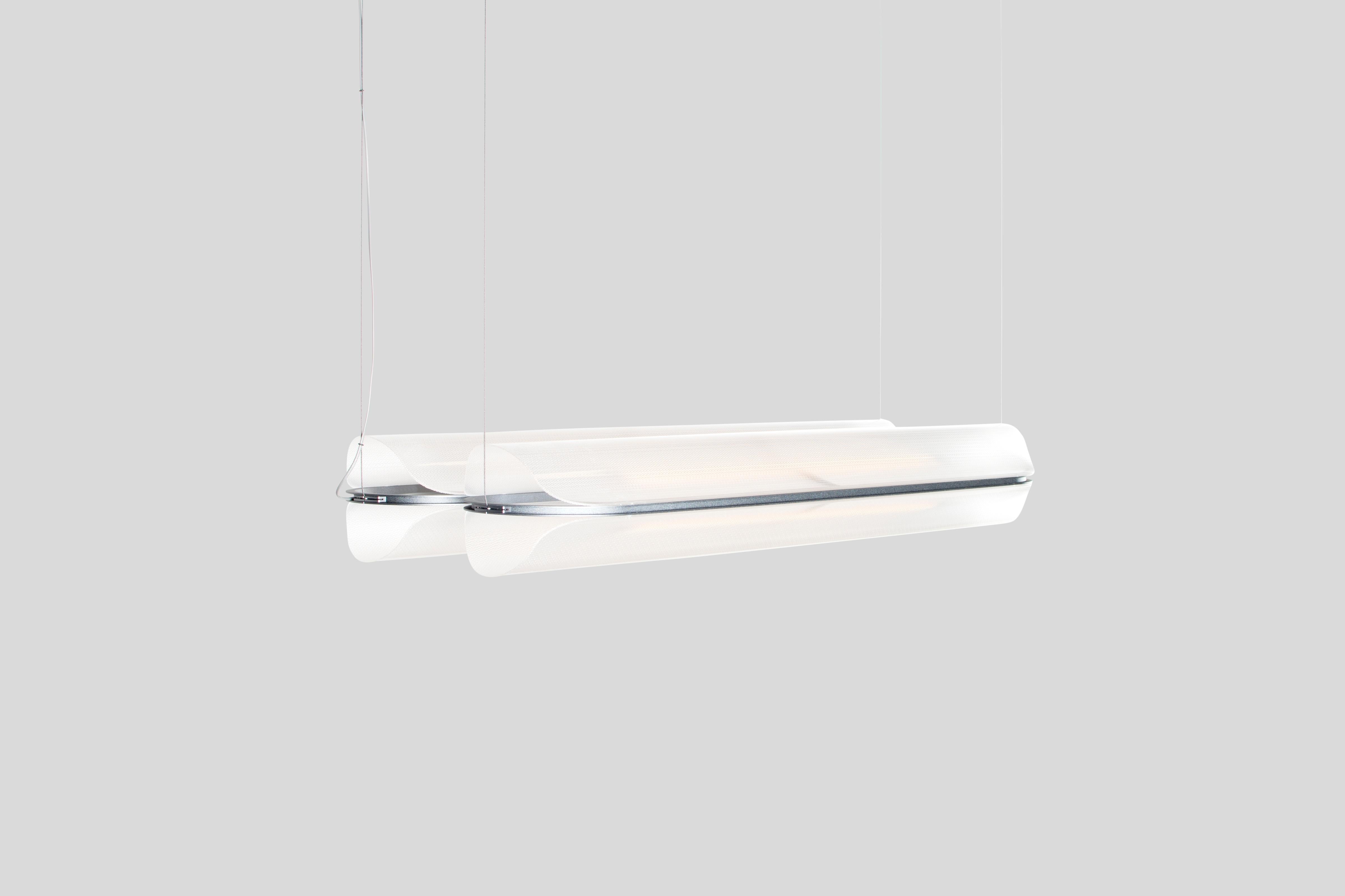 VALE - Pendant lamp
Design: Caine Heintzman, Editor: ANDLight

The Vale series optimises functionality through its multidirectional luminescence while diffusing soft ambient light.

Materials
– Acrylic
– Aluminum

Dimensions
102 x 30 x 23