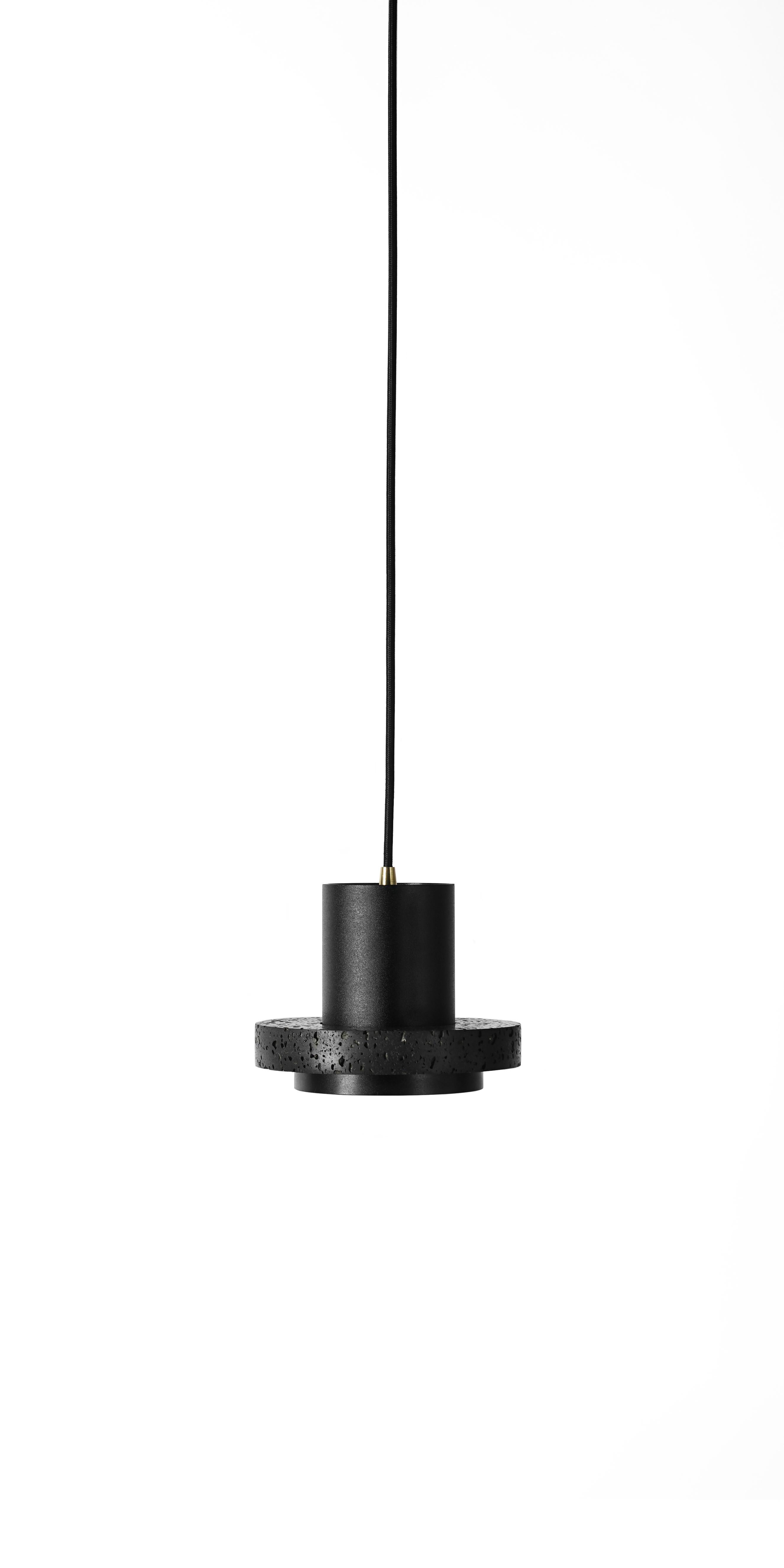 Pendant lamps 'Calm' by Buzao x Bentu design.
Black lava stone

Three different sizes:
H 14.5 cm - D 18 cm 
H 14.5 cm - D 28 cm 
H 14.5 cm - D 33 cm

(Sold individually)

19,5 cm high, 10 cm diameter
Wire: 2 meters black (adjustable) 

Lamp type: