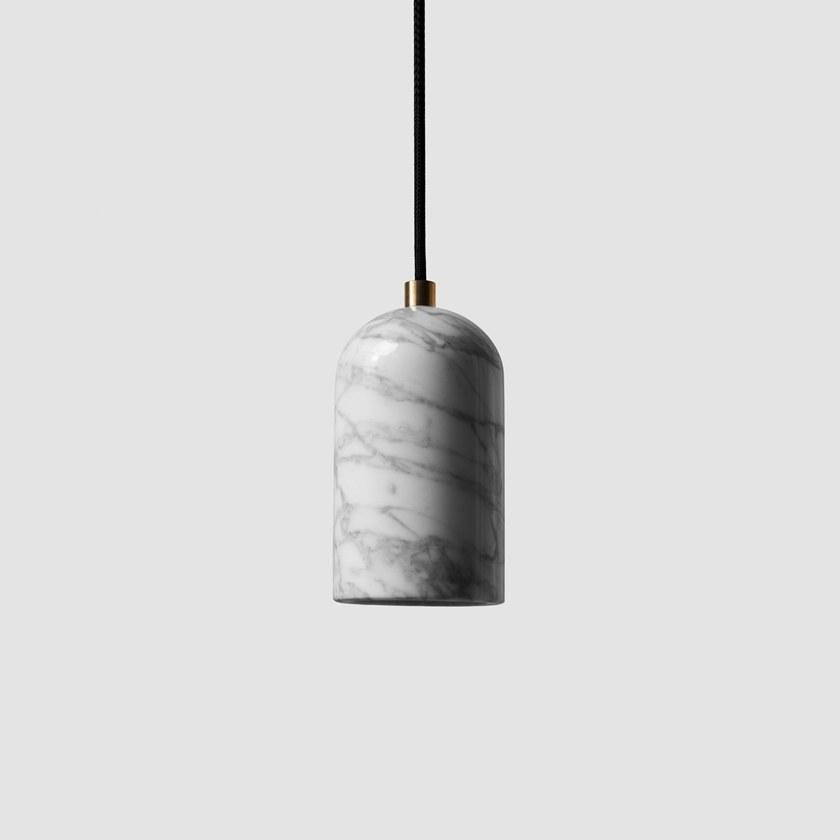 Pendant lamps 'U' by Buzao x Bentu Design. 
After concrete version, let's meet the black lava stone and white marble versions!

(Sold individually)

18 cm High; 9,6 cm Diameter
Wire: 2 Meters Black (adjustable)

Brass (gold) or aluminum (black)