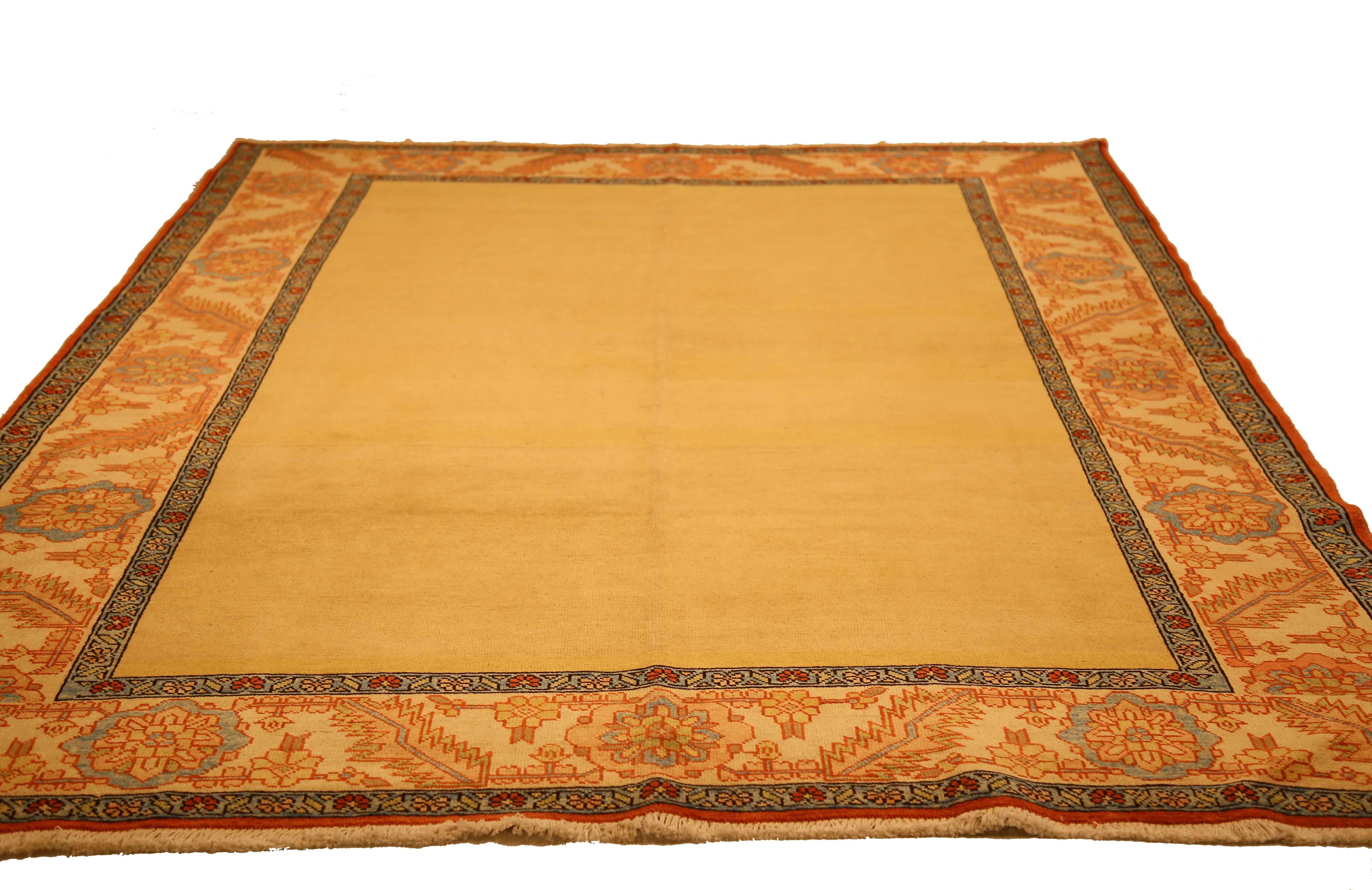 Hand-Woven Contemporary Persian Heriz Rug with an Open Yellow Center Field & Floral Borders For Sale