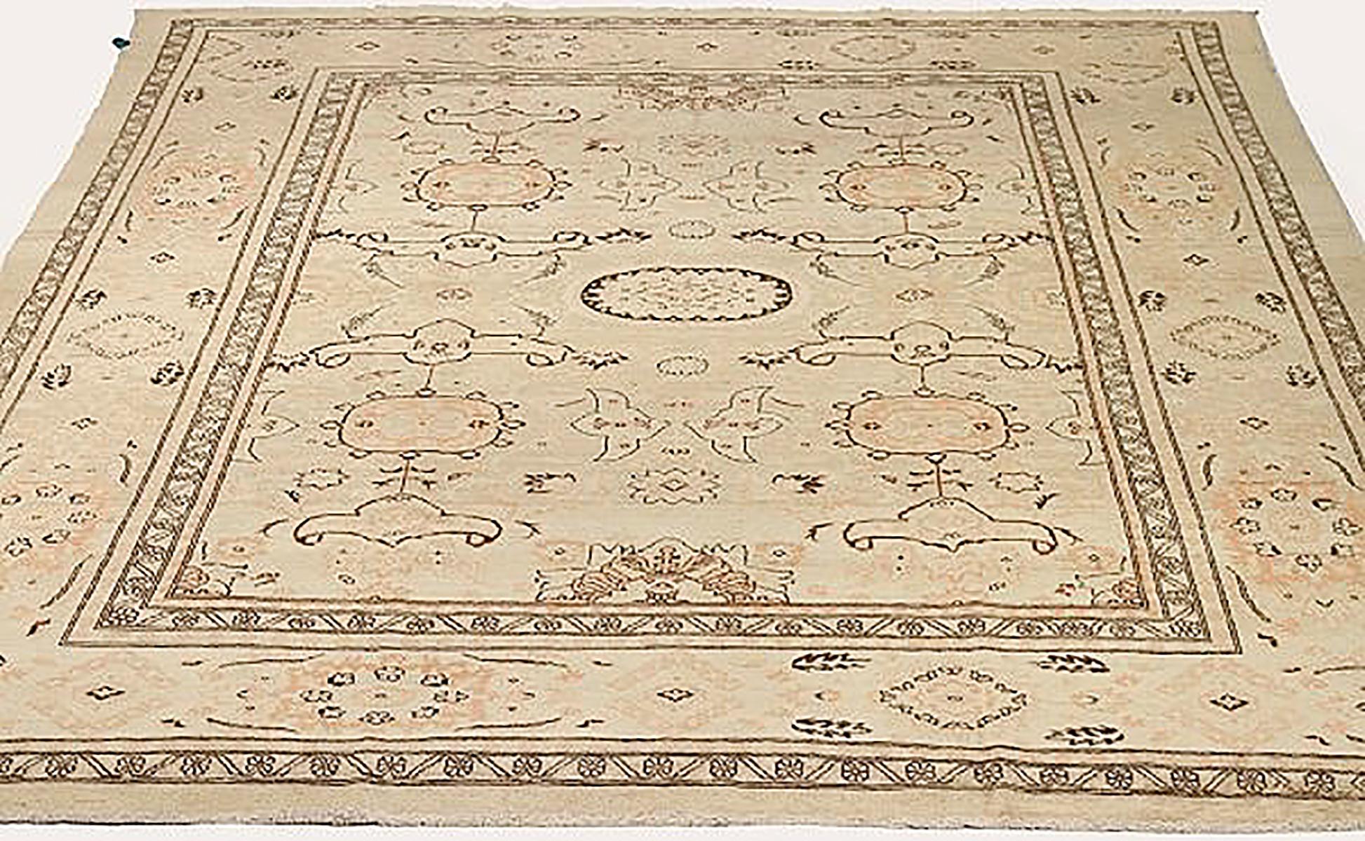Antique Persian rug handwoven from the finest sheep’s wool and colored with all-natural vegetable dyes that are safe for humans and pets. It’s a traditional Tabriz weaving featuring a lovely ensemble of floral designs in beige and black. It’s a