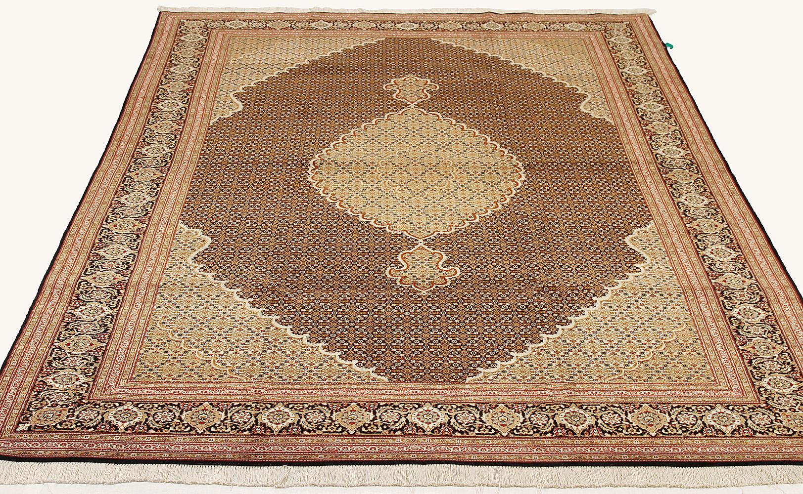Contemporary Persian rug handwoven from the finest sheep’s wool and colored with all-natural vegetable dyes that are safe for humans and pets. It’s a traditional Tabriz weaving featuring a lovely ensemble of floral designs in white and brown over a