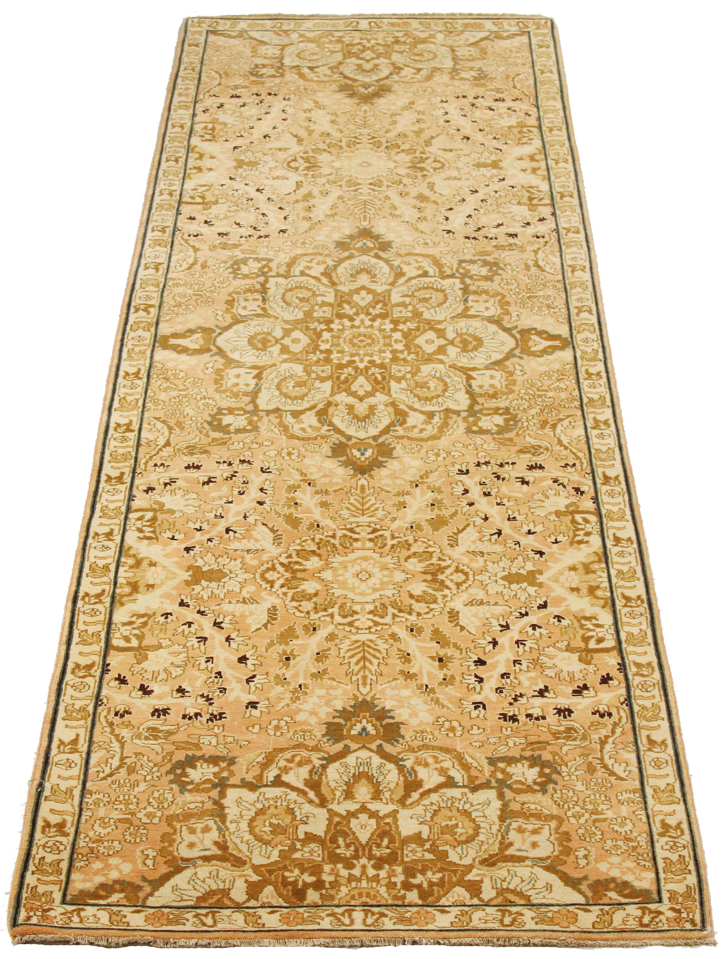 Contemporary Persian rug handwoven from the finest sheep’s wool and colored with all-natural vegetable dyes that are safe for humans and pets. It’s a traditional Tabriz weaving featuring a lovely ensemble of floral designs in brown and ivory over a
