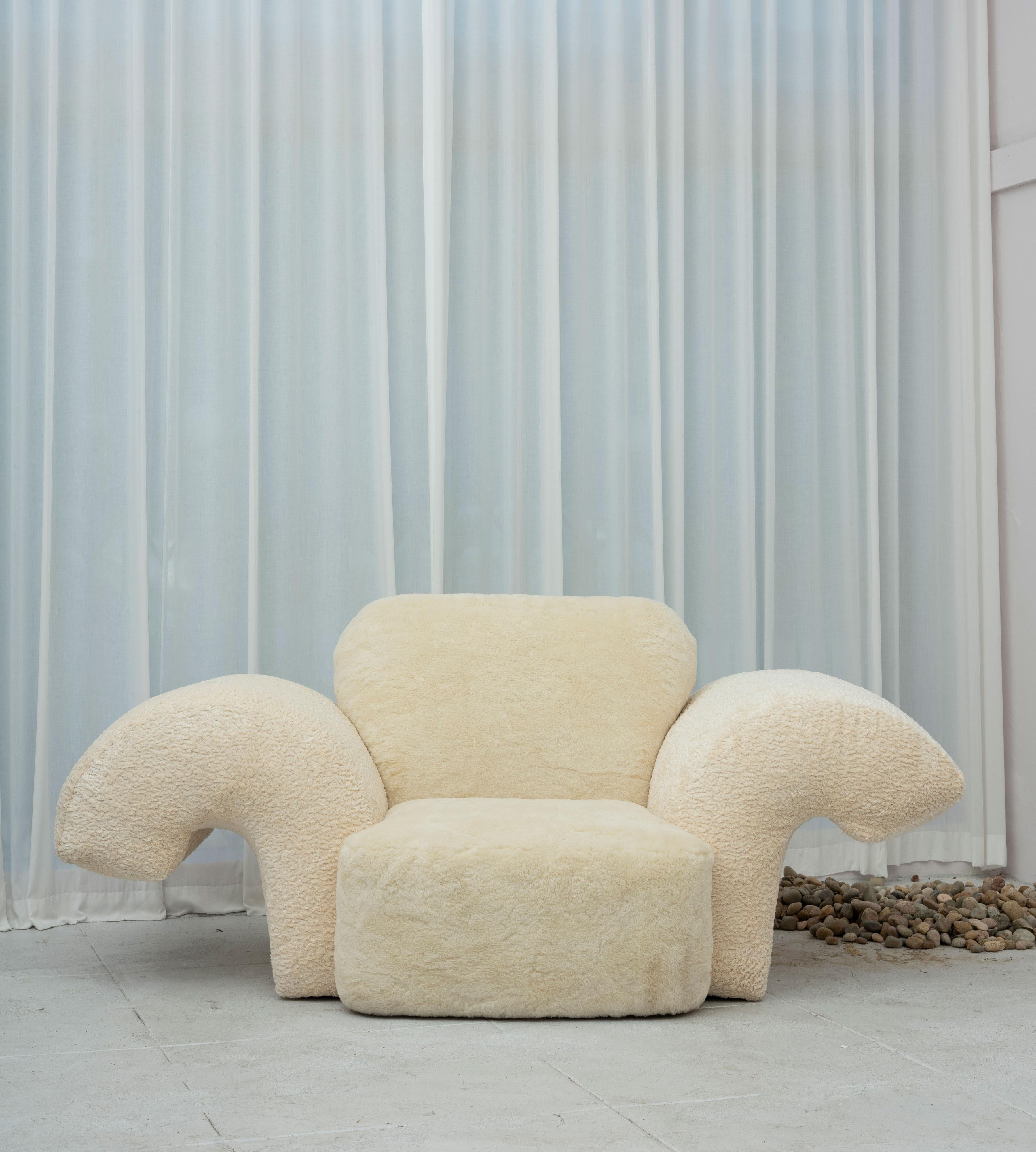 The Piazza chair invites a crowd to hang in and around it’s large footprint, much like the gathering places in Italian cities. Shown in Feather Boucle on the arms, and Yeti Wool for the seat and back. Made in Los Angeles.
 
SAMPLE: THIS ITEM IS A