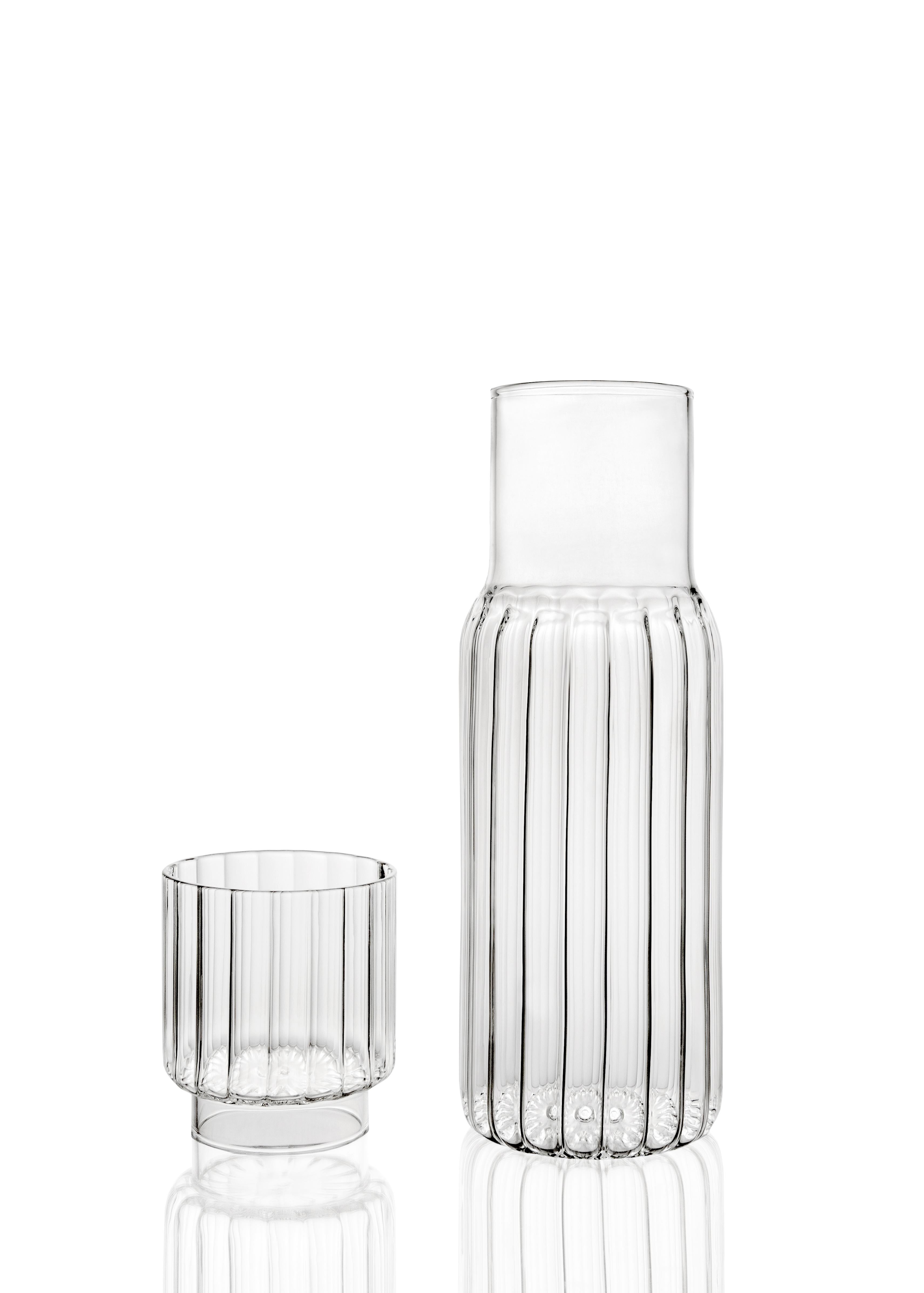 The linear form of the PILLAR carafe is inspired by architecture, and characterized by an understated yet imposing appeal.

A PILLAR tumbler glass is included in the set, serving as a lid for this versatile container that compliments the nightstand