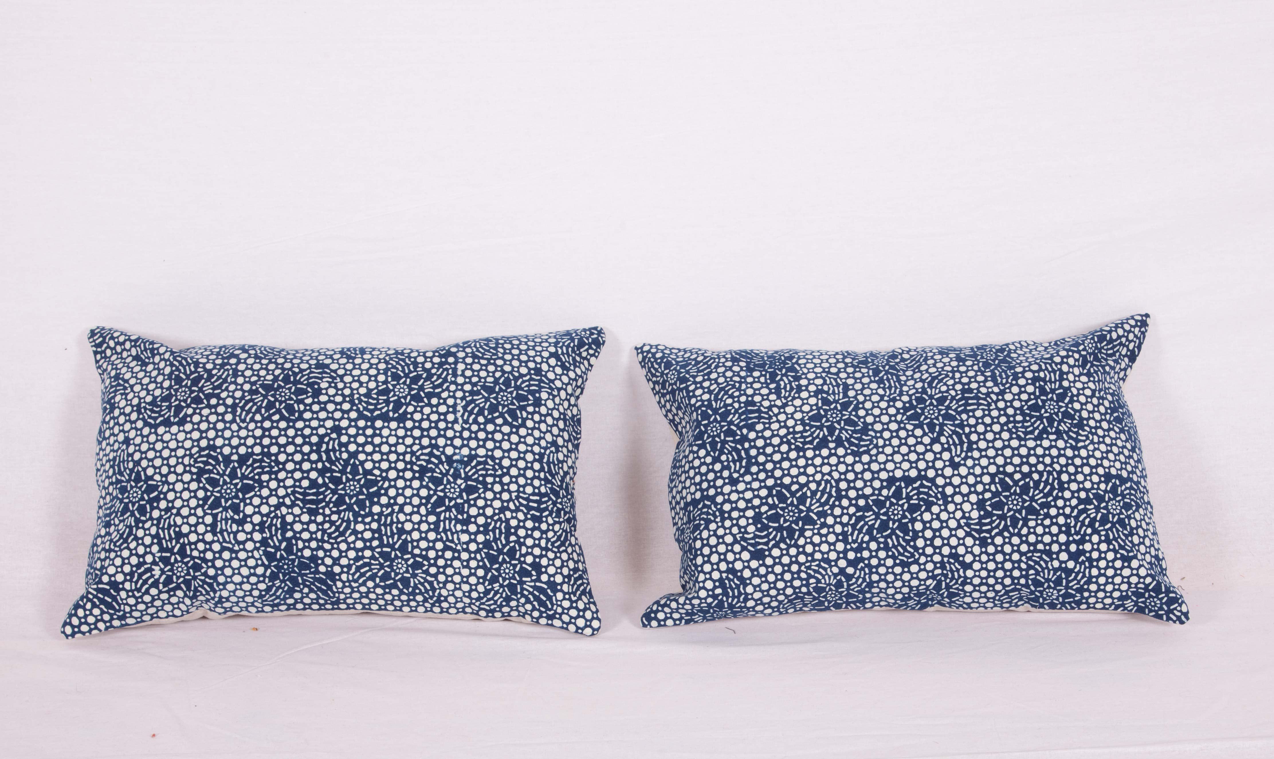 The pillows are made from a contemporary indigo, Miao textile. They do not come with inserts but come with bags made to the size and out of cotton to accommodate the filling. The backing is made of linen. Please note filling is not provided. Since