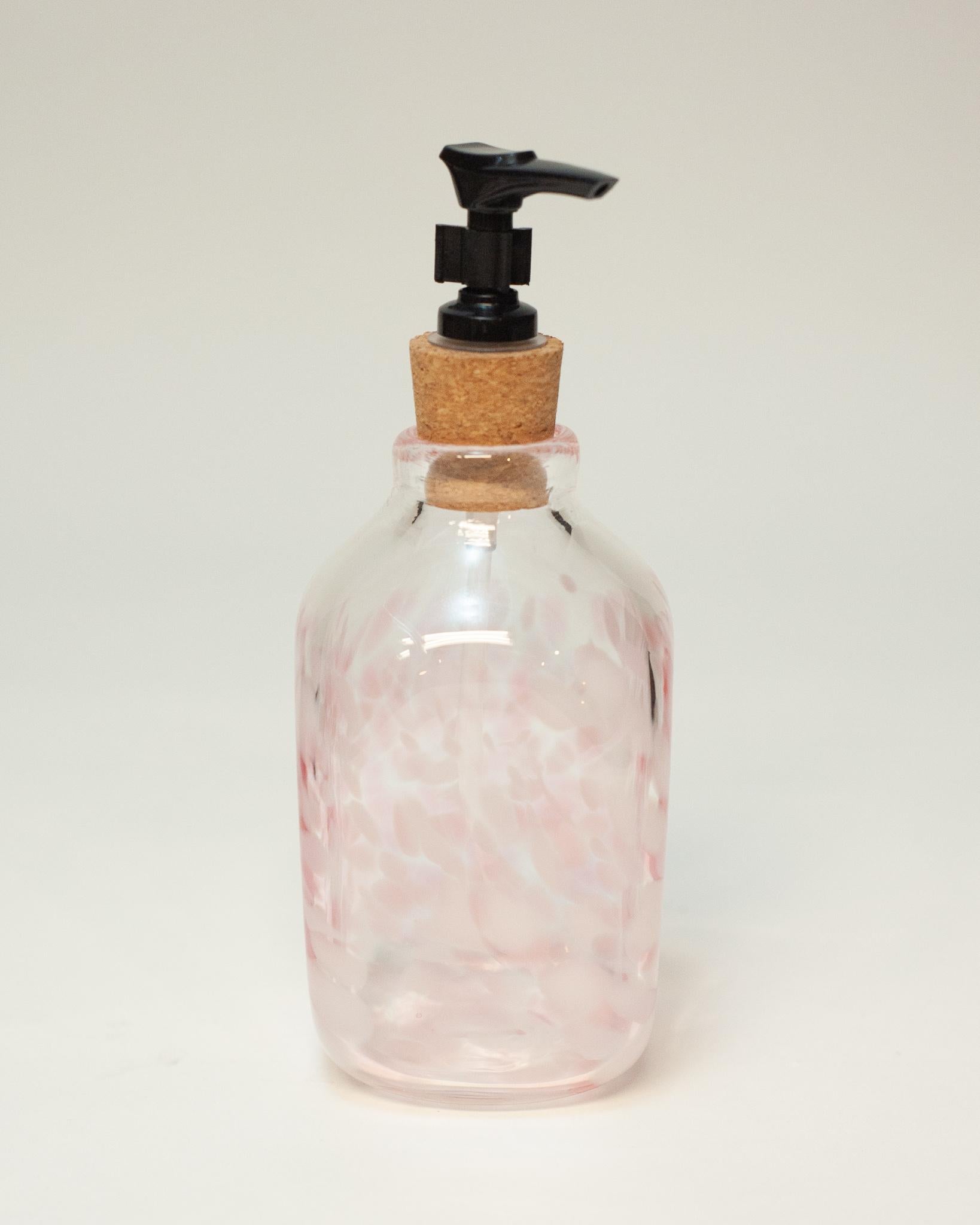 A stunning contemporary small pink tonal blown glass soap dispenser by a Canadian artist.