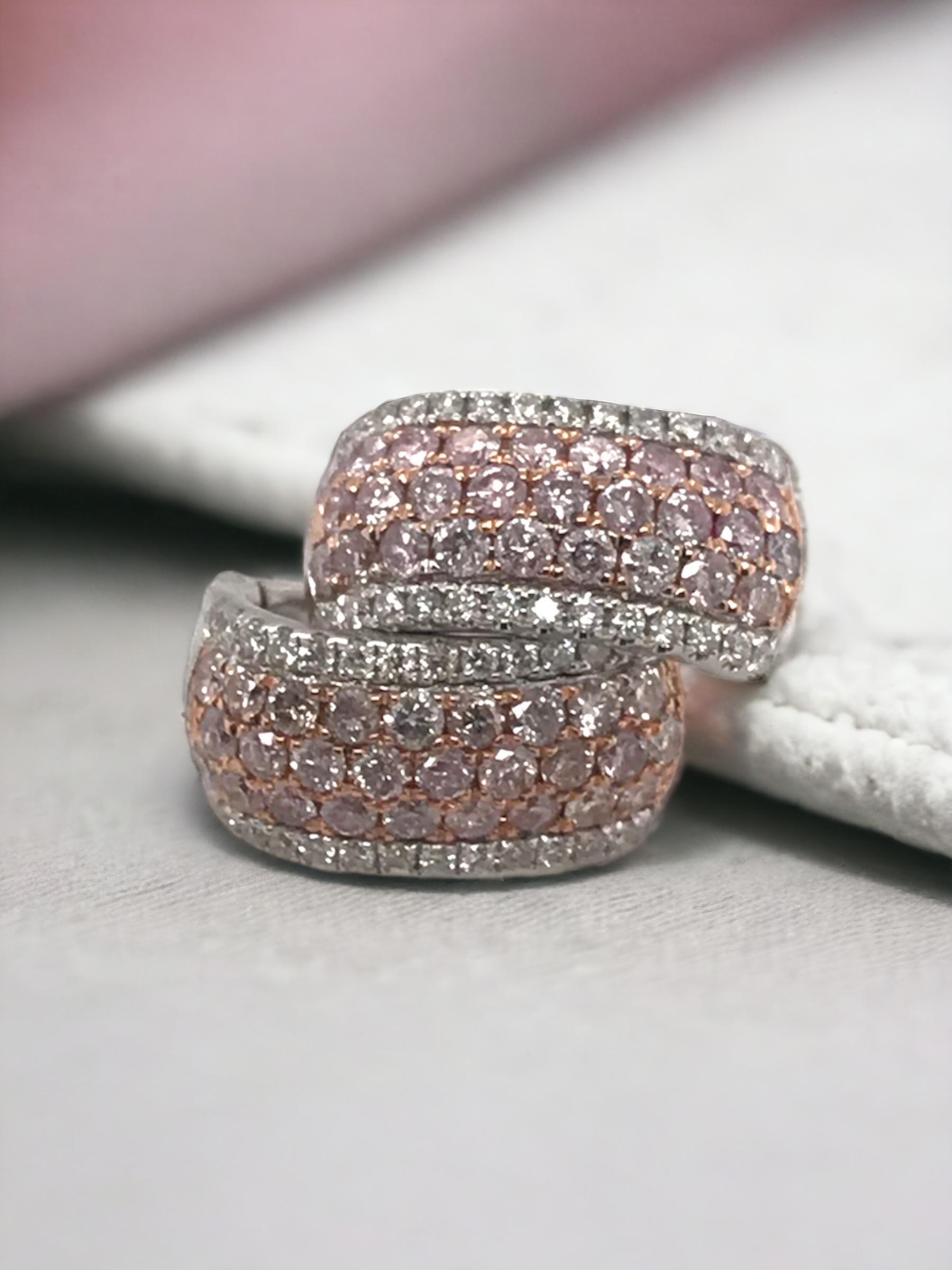 We are loving these pink diamond earrings!!
Pink diamonds happen to be one of the rarer at natural diamond colors.

Earring Details
Material: 14K White & Rose Gold
Length: 1/2 Inch
Width: 1/4 Inch
Weight: 3.8 Grams

Accented by the following
