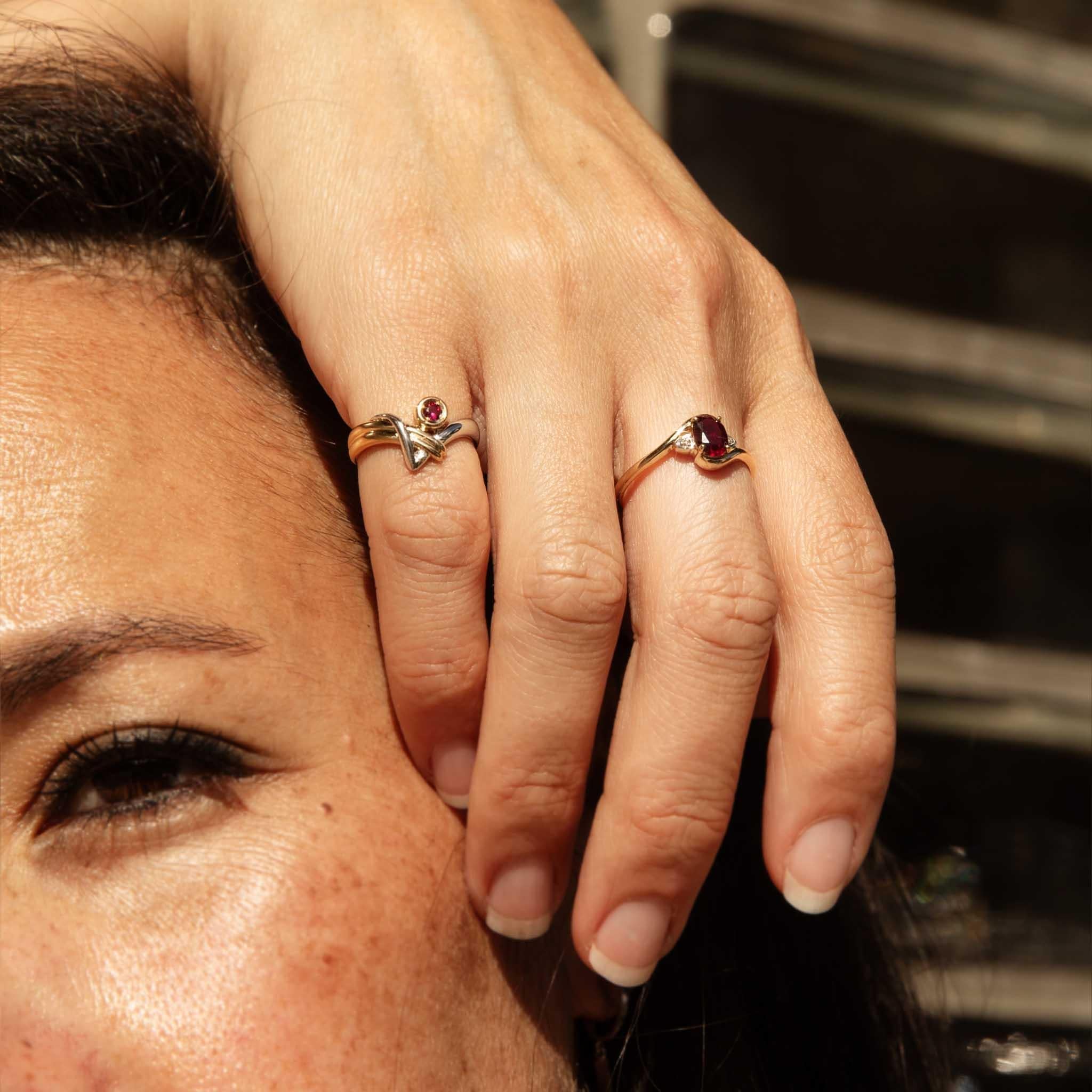 A vibrant burst of passion, the Goldie Ruby Ring captivates with her rich, crimson heart. A round ruby, nestled in a platinum bezel, is embraced by flowing ribbons of 18ct yellow gold. With her striking contrast of metals and the ruby's fiery glow