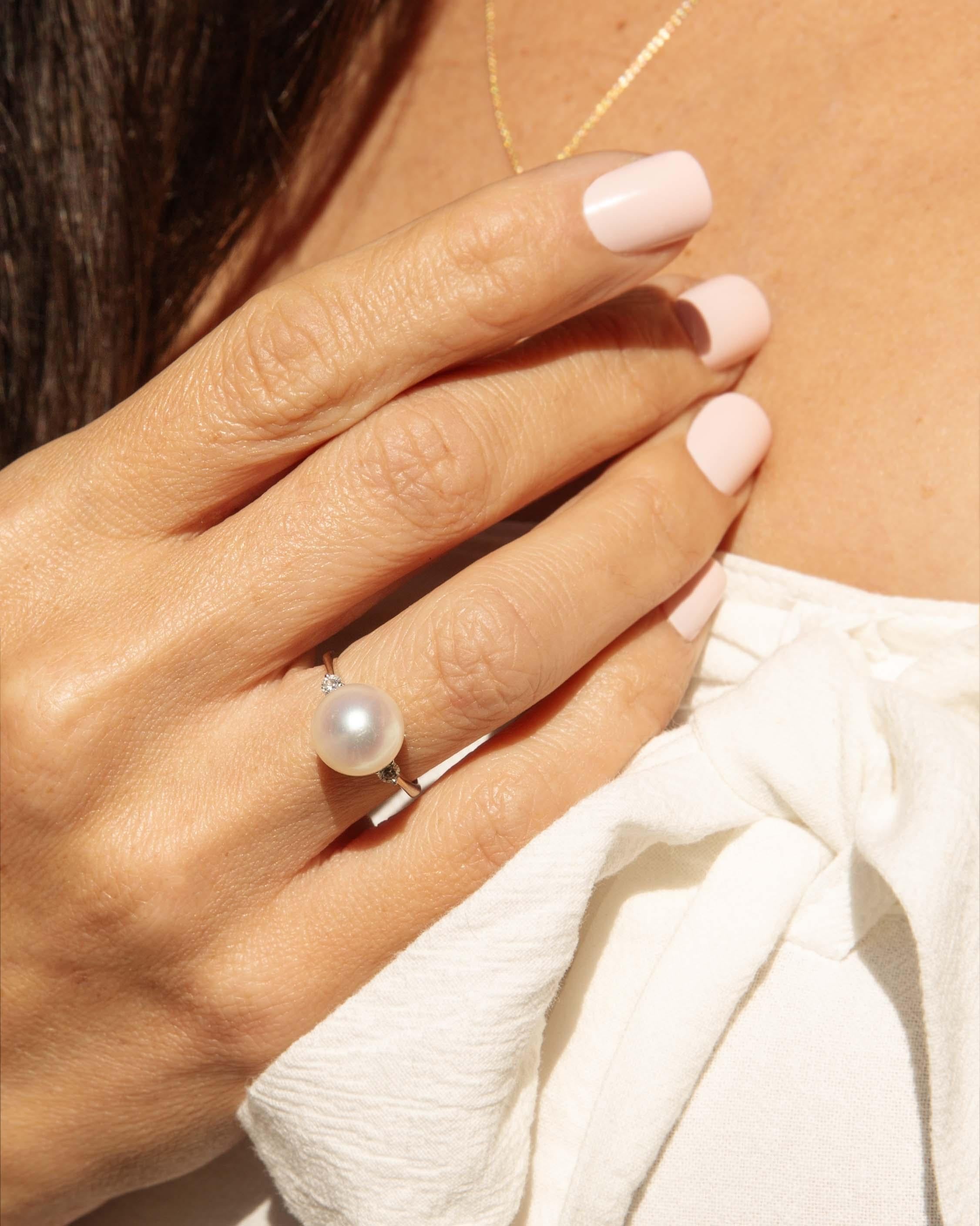 Embrace elegance with the Amrita pearl & diamond Ring, a breathtaking fusion of 18 carat white gold that radiates timeless beauty. Adorned with luminous pearls and shimmering diamonds, this exquisite piece captures the light in a dance of opulence.