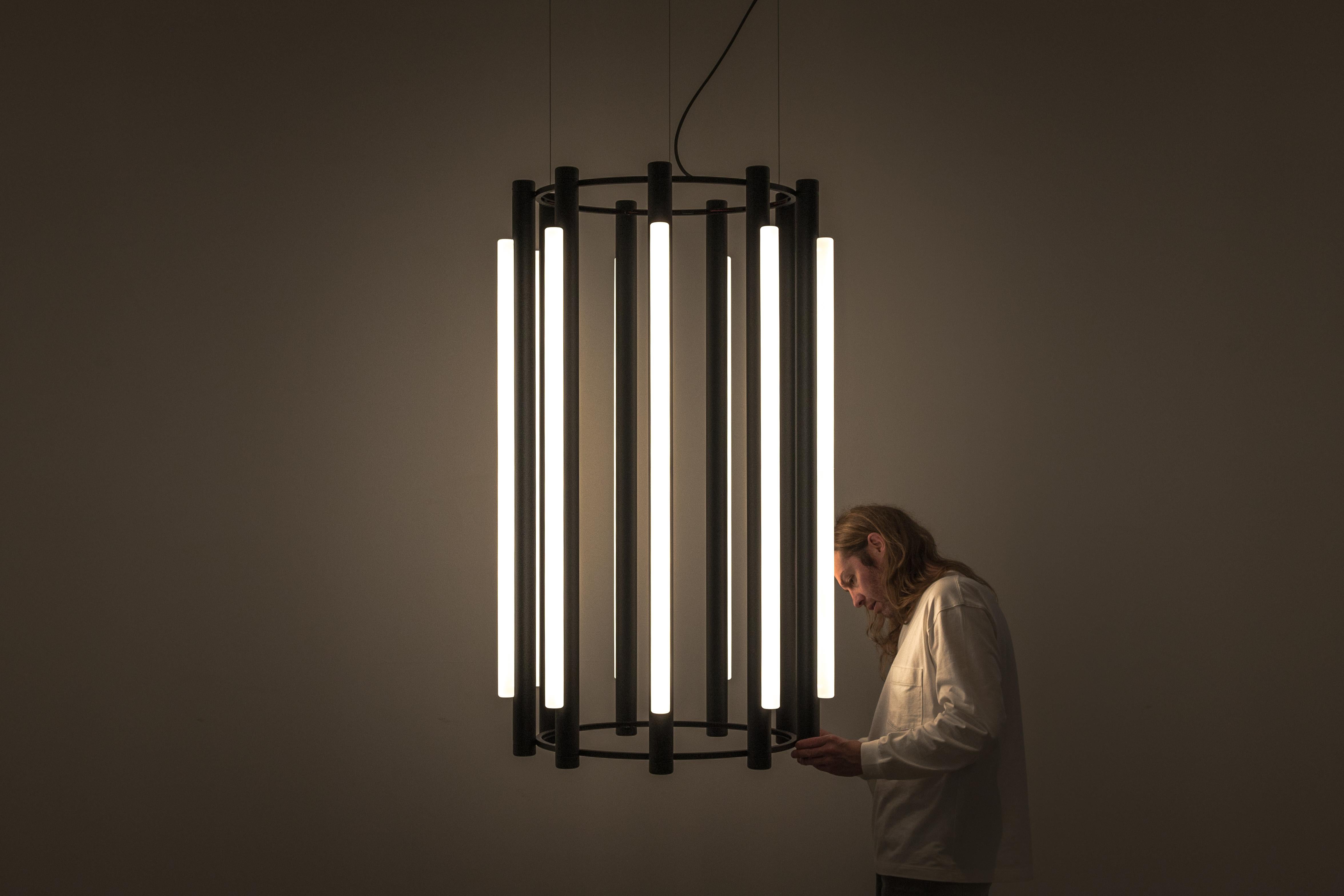 Pipeline chandelier 5
Design: Caine Heintzman, Editor: AND Light

By definition, the Pipeline Chandelier features a cylindrical arrangement of linear illuminated sections cinched by metal hoops. Its carousel like form proposes an unconventional