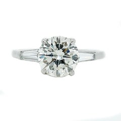 Contemporary Platinum Round and Baguette Diamond Ring with GIA Report