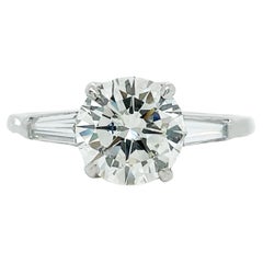 Contemporary Platinum Round and Baguette Diamond Ring with GIA Report