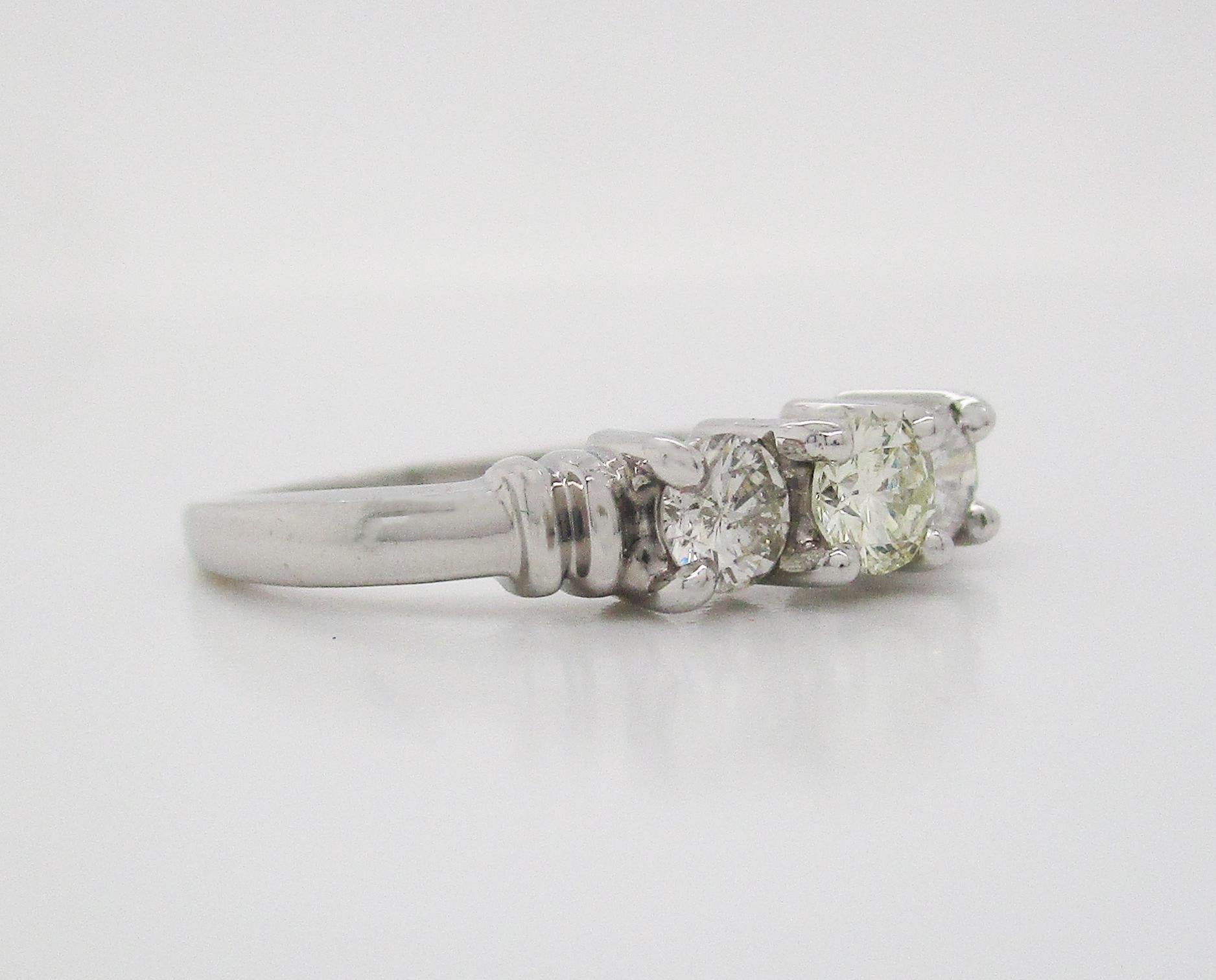 Round Cut Contemporary Platinum Three-Stone Diamond Engagement Ring