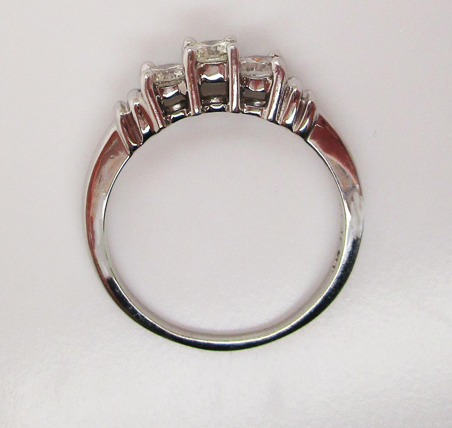 Contemporary Platinum Three-Stone Diamond Engagement Ring 1