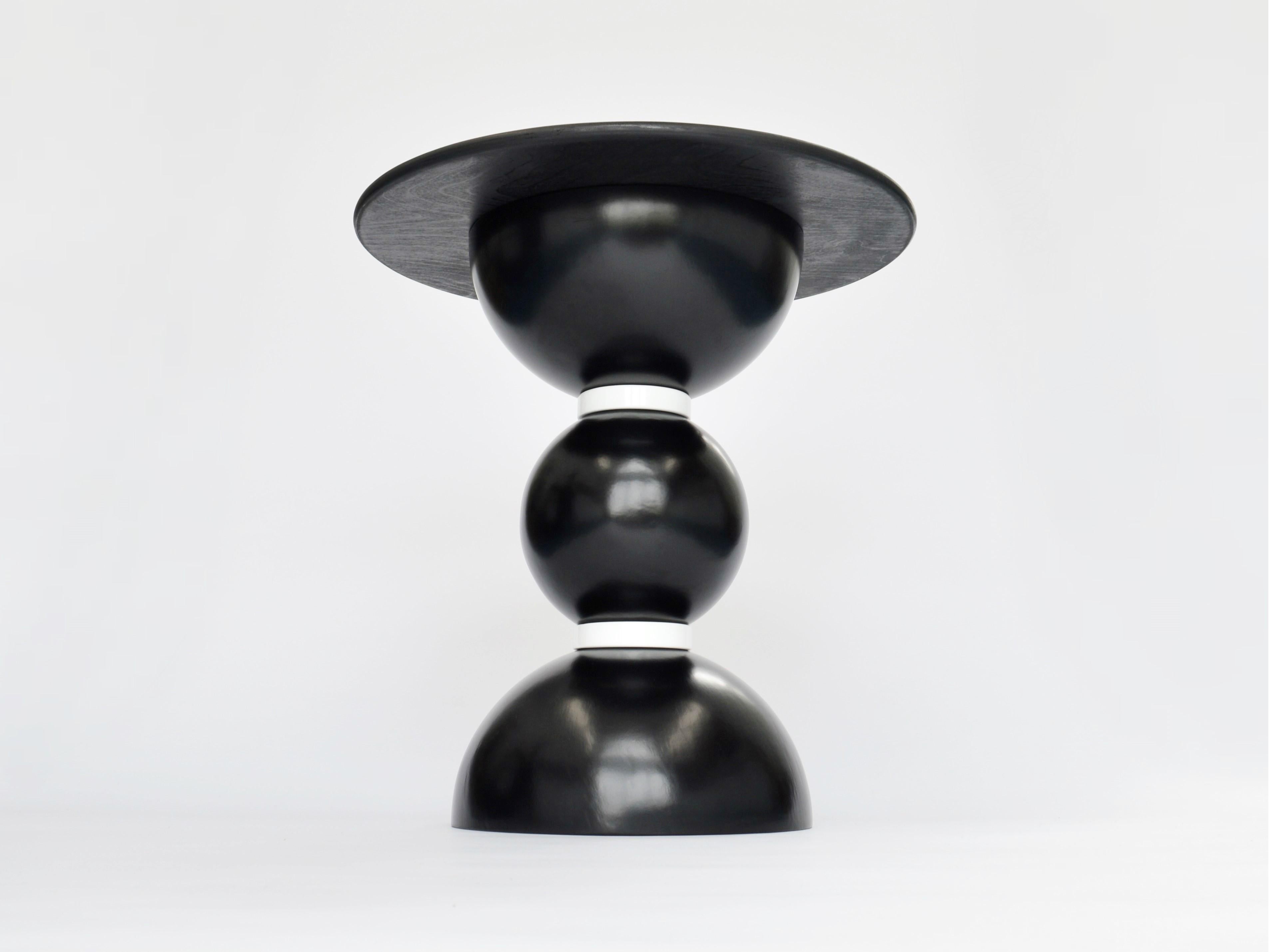 Contemporary side table designed and made by independent product and furniture designer Connor Holland.

The Pluto table is a black edition of the Saturn table from my Saturn six range. The rounded shapes of the table mimic the designs of rocket
