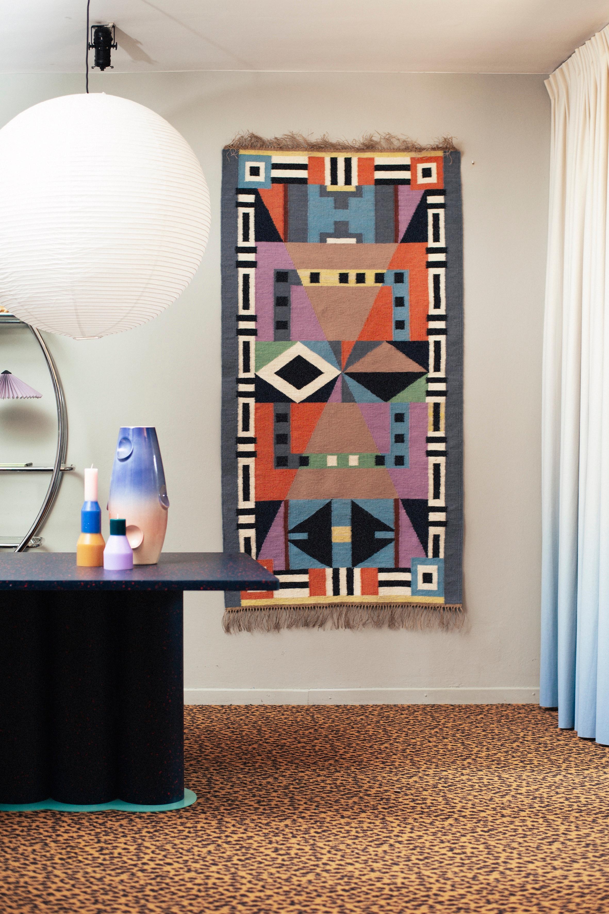 The RAPALLO kilim opens a series inspired by the Memphis Milano aesthetic, which defined the colorful design style of the 1980s and 90s. The designer. Piotr Niklas, in his own unique way, transformed the realizations of such designers as Ettore