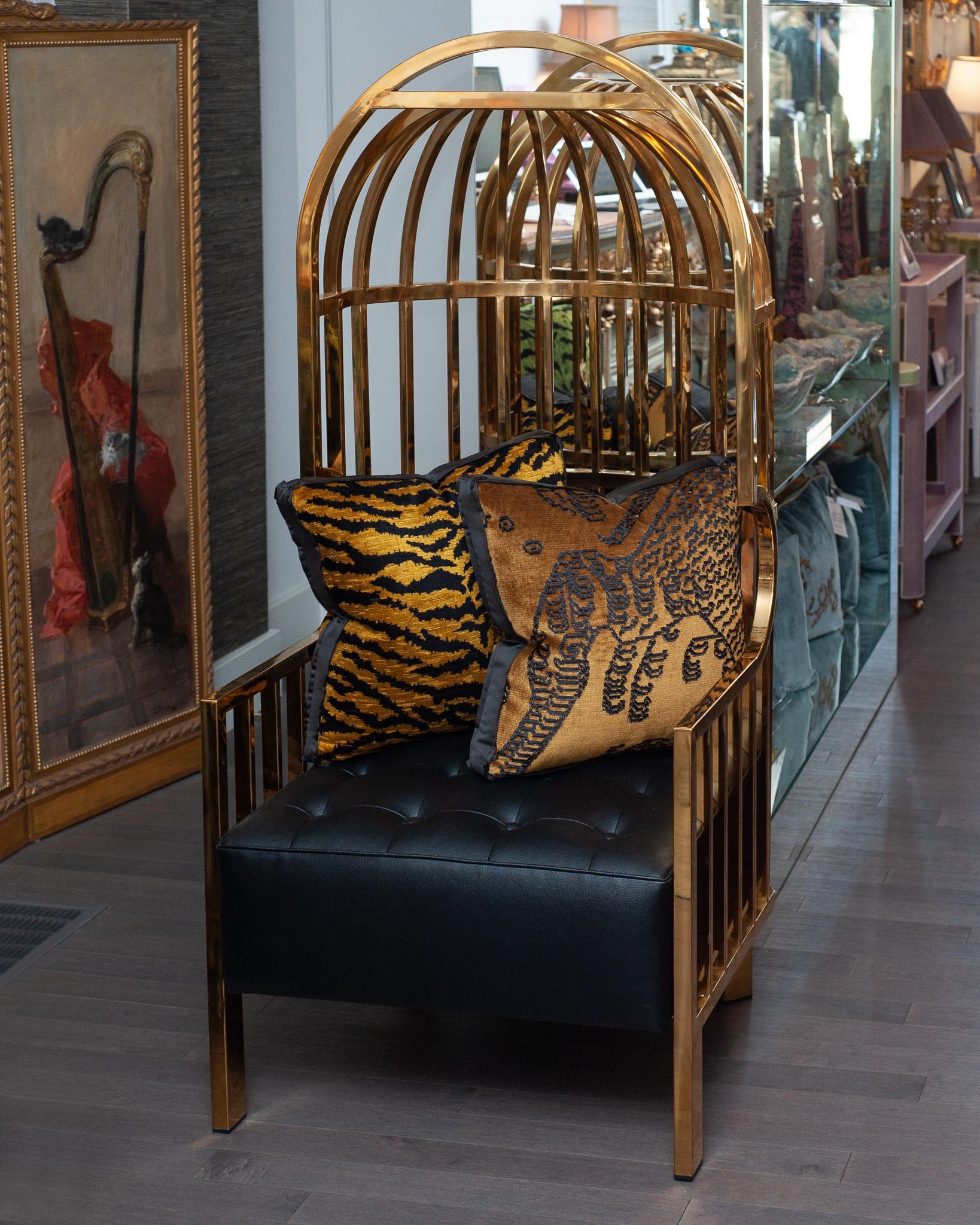 A magnificent contemporary large polished brass birdcage chair, upholstered with tufted leather. A new reinterpretation of the classic Porter chair in a mid century modern style, this is the perfect statement chair exuding glamour and luxury for any