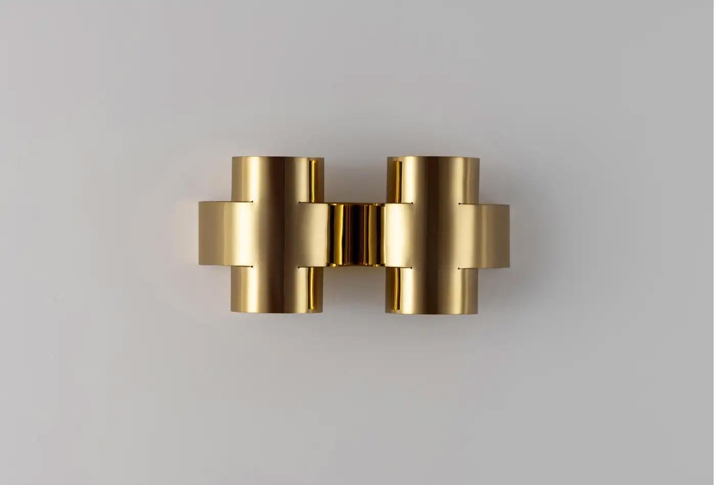 Contemporary Polished Brass Wall Sconce, Plus Two Large Lamp by Paul Matter

PLUS Series is a new range of appliqués by Paul Matter that feature a simple shape in singular and repetitive arrangements. A 3-Dimensional plus is formed out of a single
