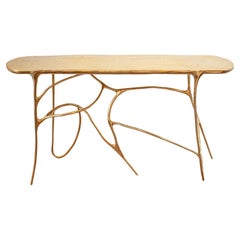 Table console sculpturale contemporaine en laiton moulé poli