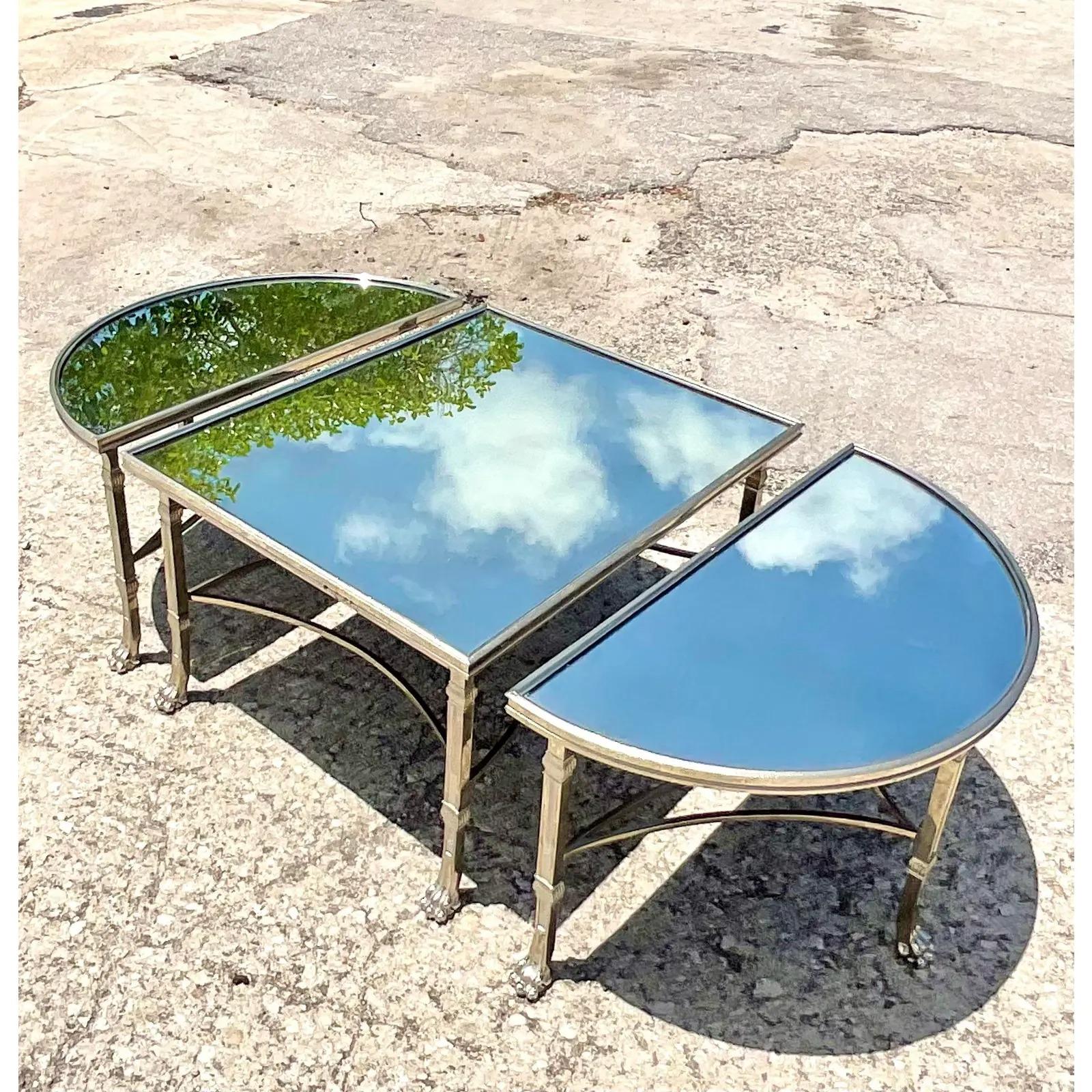 Fantastic vintage Lorin Marsh coffee table. Beautiful polished nickel in a chic Regency design. The table has three separate tables that are put together to create one table. Can also be separated to three distinct smaller tables. You decide!