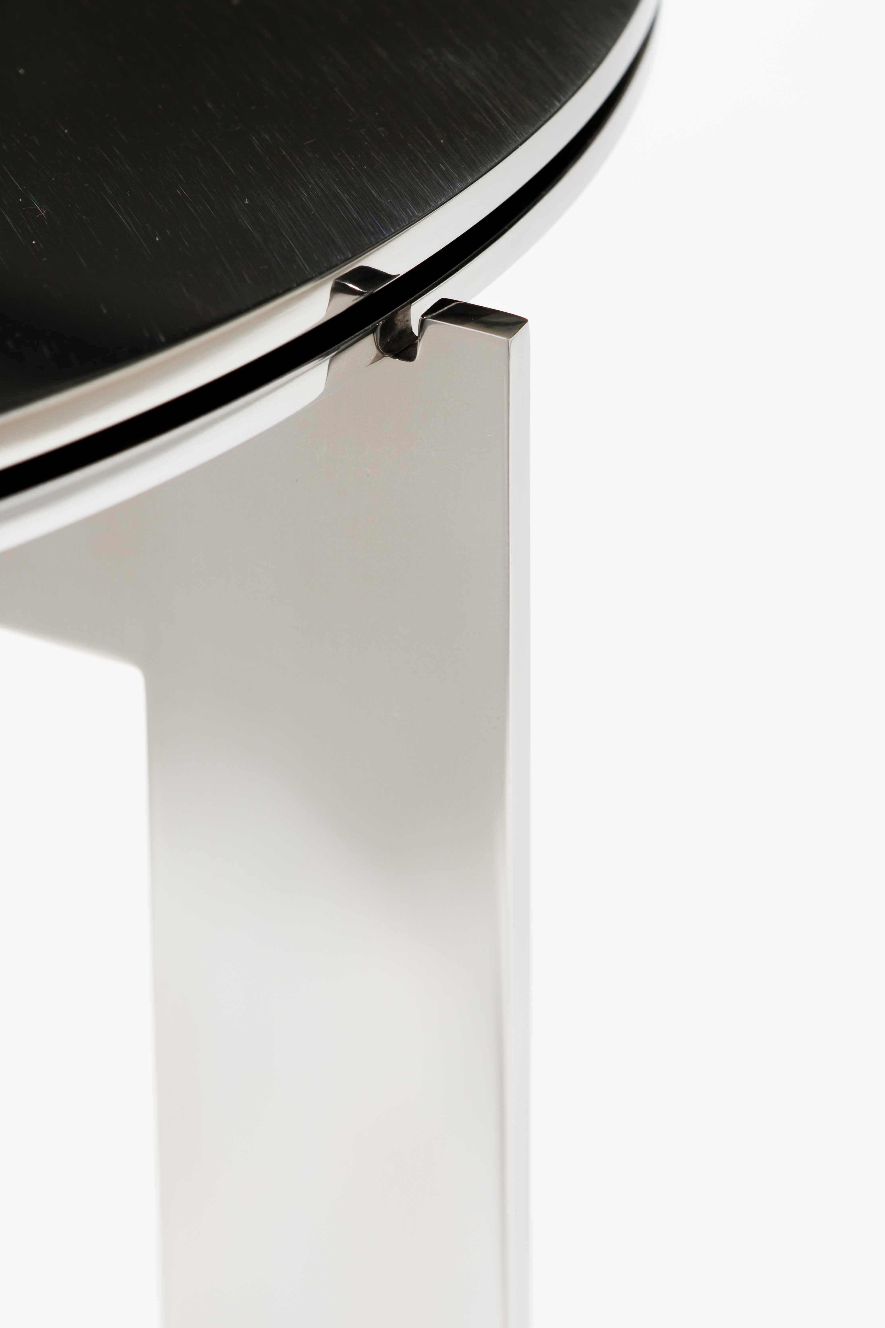 Joined is a collection of side tables. The name speaks for itself. The tables have one thing in common, they all exist around a crucial part, the joint, keeping all pieces together. 

This version: round side table with polished stainless steel base