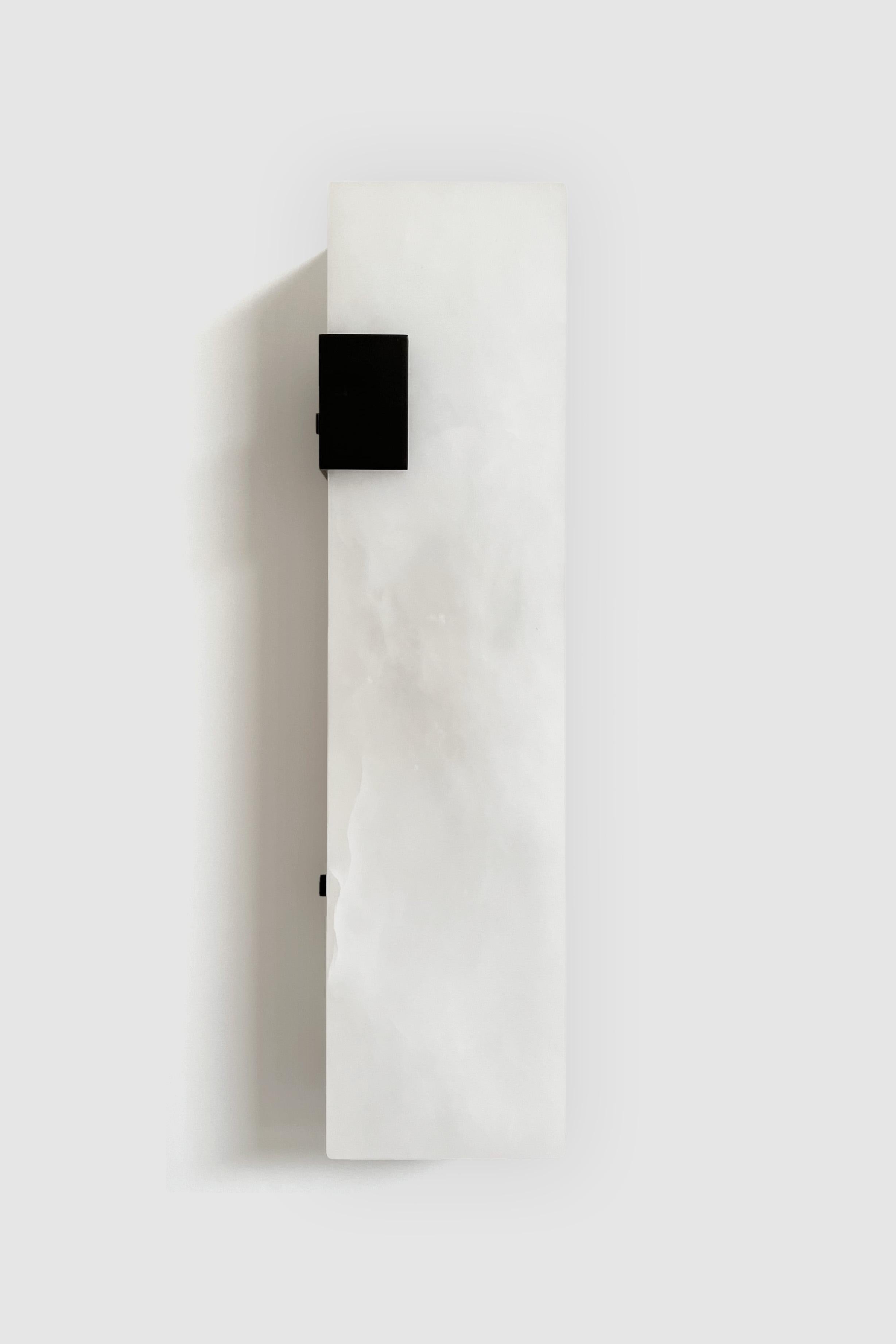 Orphan Work 003-1C Sconce
Shown in blackened brass and alabaster
Available in brushed brass, brushed nickel and blackened brass
Measures: 19” H x 5 1/4” W x 3 7/8” D
Wall or ceiling mount
Vertical or horizontal
Plug-in by request
1-4 adjustable