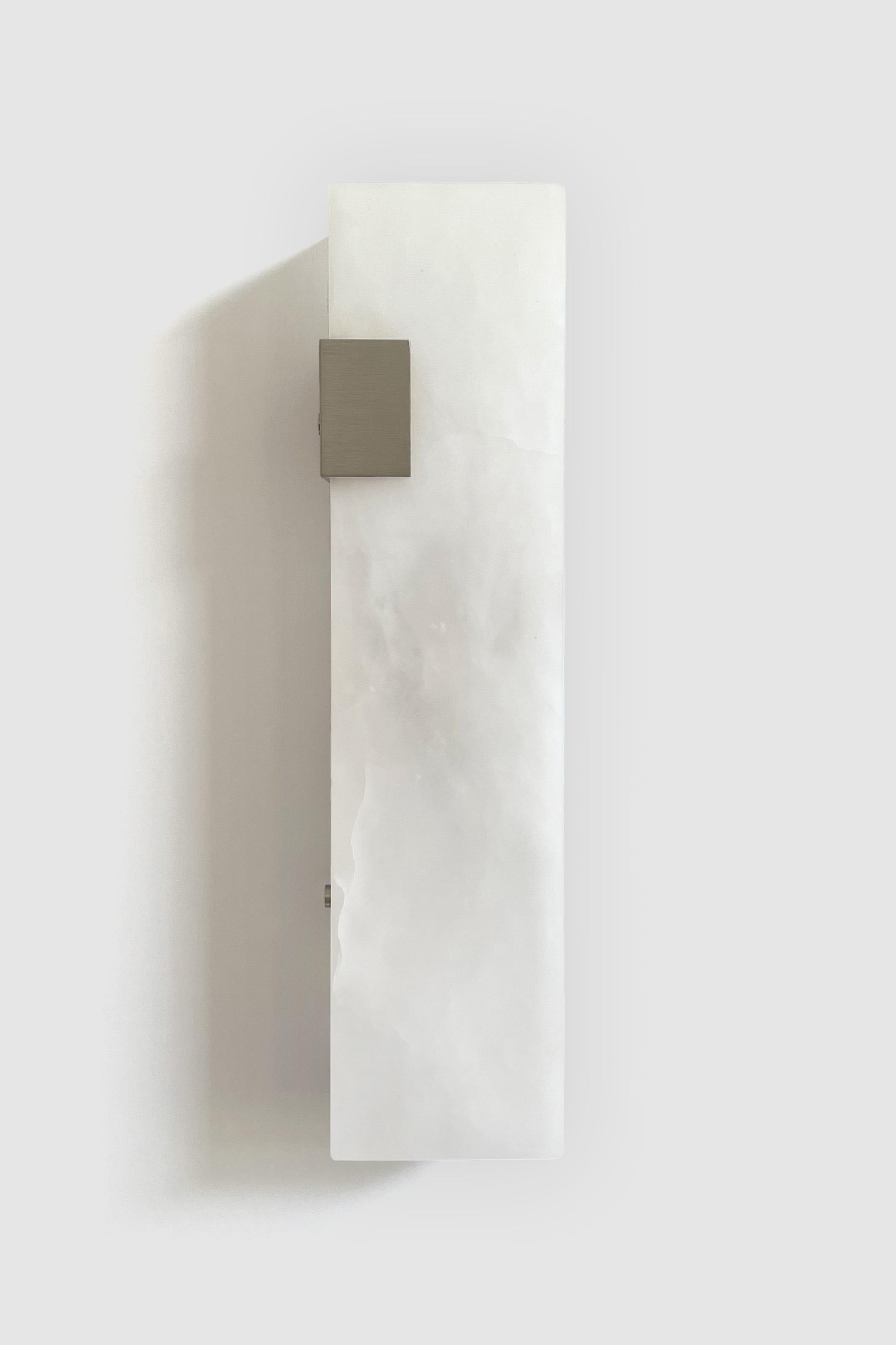 Orphan Work 003-1C Sconce
Shown in brushed nickel and alabaster 
Available in brushed brass, brushed nickel and blackened brass
Measures: 19” H x 5 1/4” W x 3 7/8” D
Wall or ceiling mount
Vertical or horizontal
Plug-in by request
1-4 adjustable