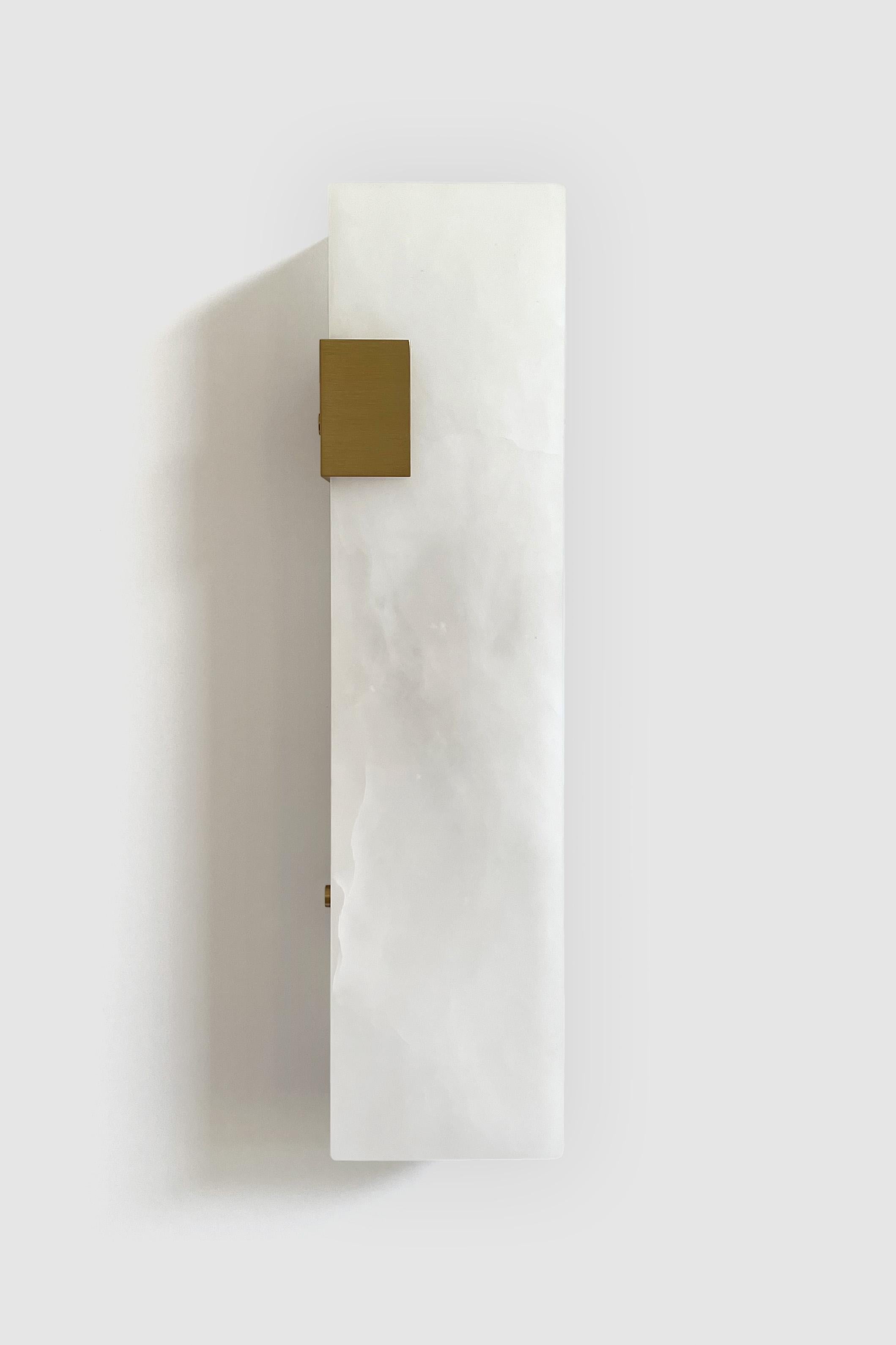 Orphan Work 003-1C Sconce
Shown in brushed brass and alabaster 
Available in brushed brass, brushed nickel and blackened brass
Measures: 19” H x 5 1/4” W x 3 7/8” D
Wall or ceiling mount
Vertical or horizontal
Plug-in by request
1-4 adjustable