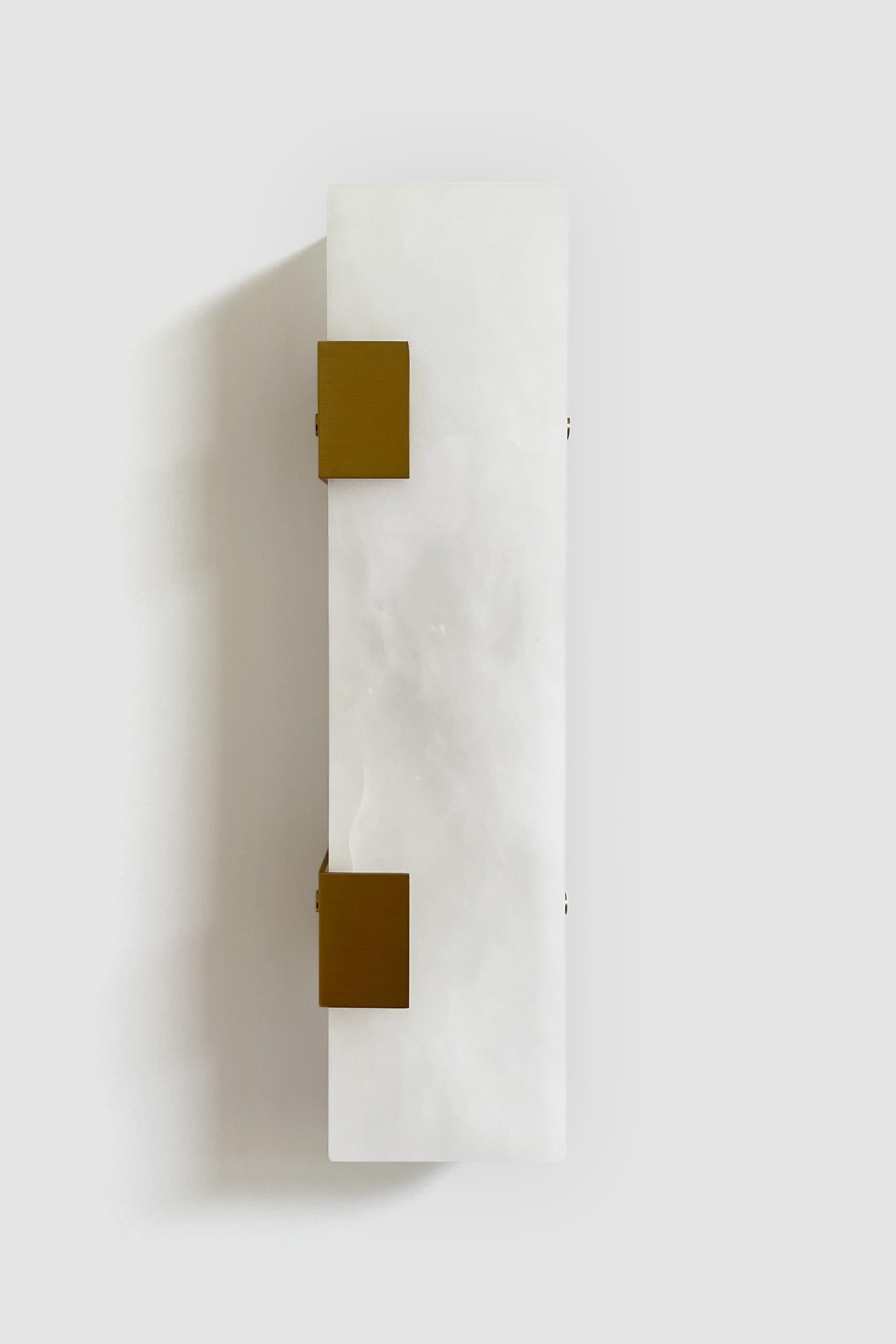 Orphan Work 003-2C Sconce
Shown in brushed brass and alabaster
Available in brushed brass, brushed nickel and blackened brass
Measures: 19” H x 5 1/4” W x 3 7/8” D
Wall or ceiling mount
Vertical or horizontal
Plug-in by request
1-4 adjustable