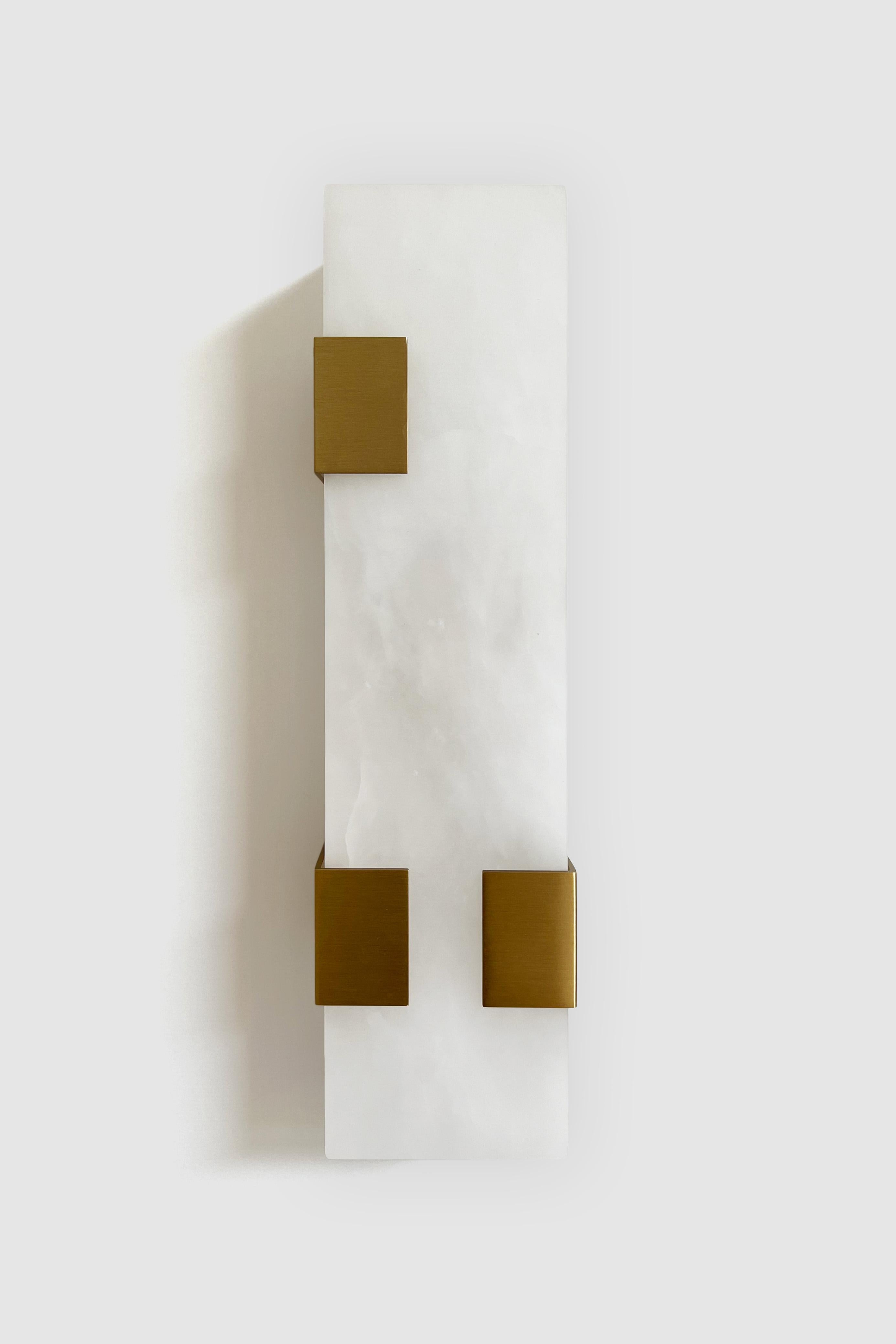 Orphan work 003-3C Sconce
Shown in brushed brass and alabaster
Available in brushed brass, brushed nickel and blackened brass
Measures: 19”H x 5 1/4”W x 3 7/8”D
Wall or ceiling mount
Vertical or horizontal
Plug-in by request
1-4 adjustable clips
UL