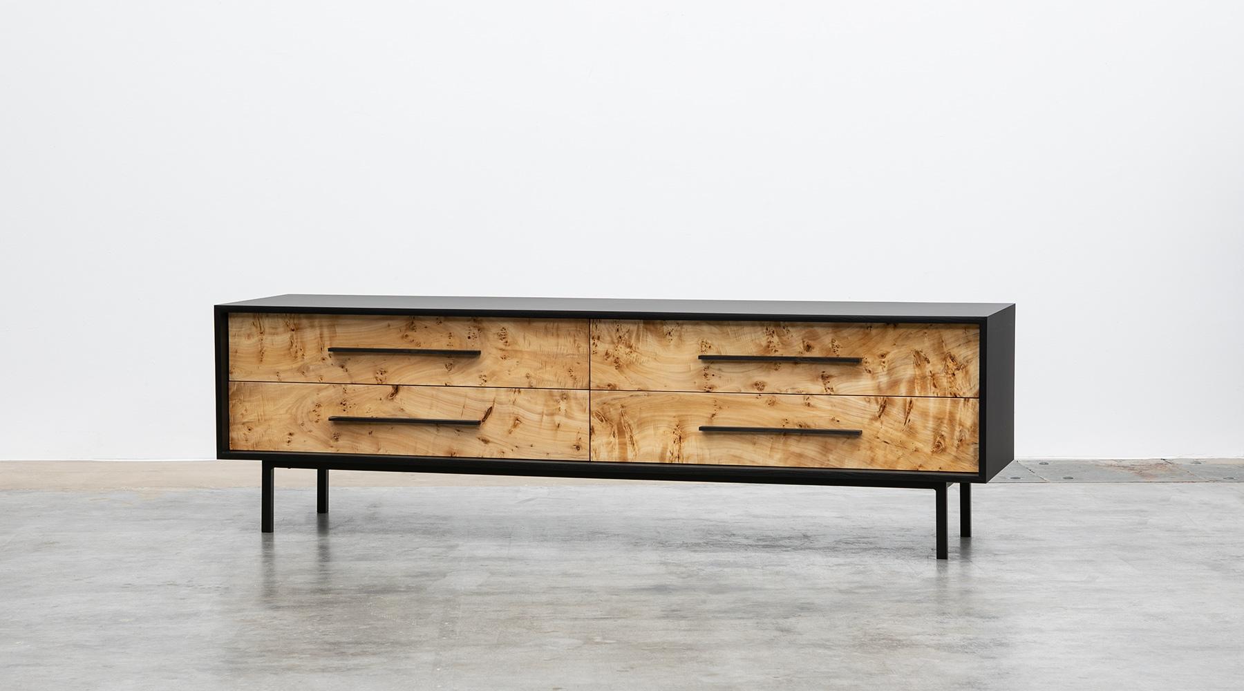 Sideboard by contemporary German artist Johannes Hock. The front of the doors of this unique piece comes in poplar burl wood with ebony handles. The inside life of the four drawers are designed with red or black HPL, as well as the backside.