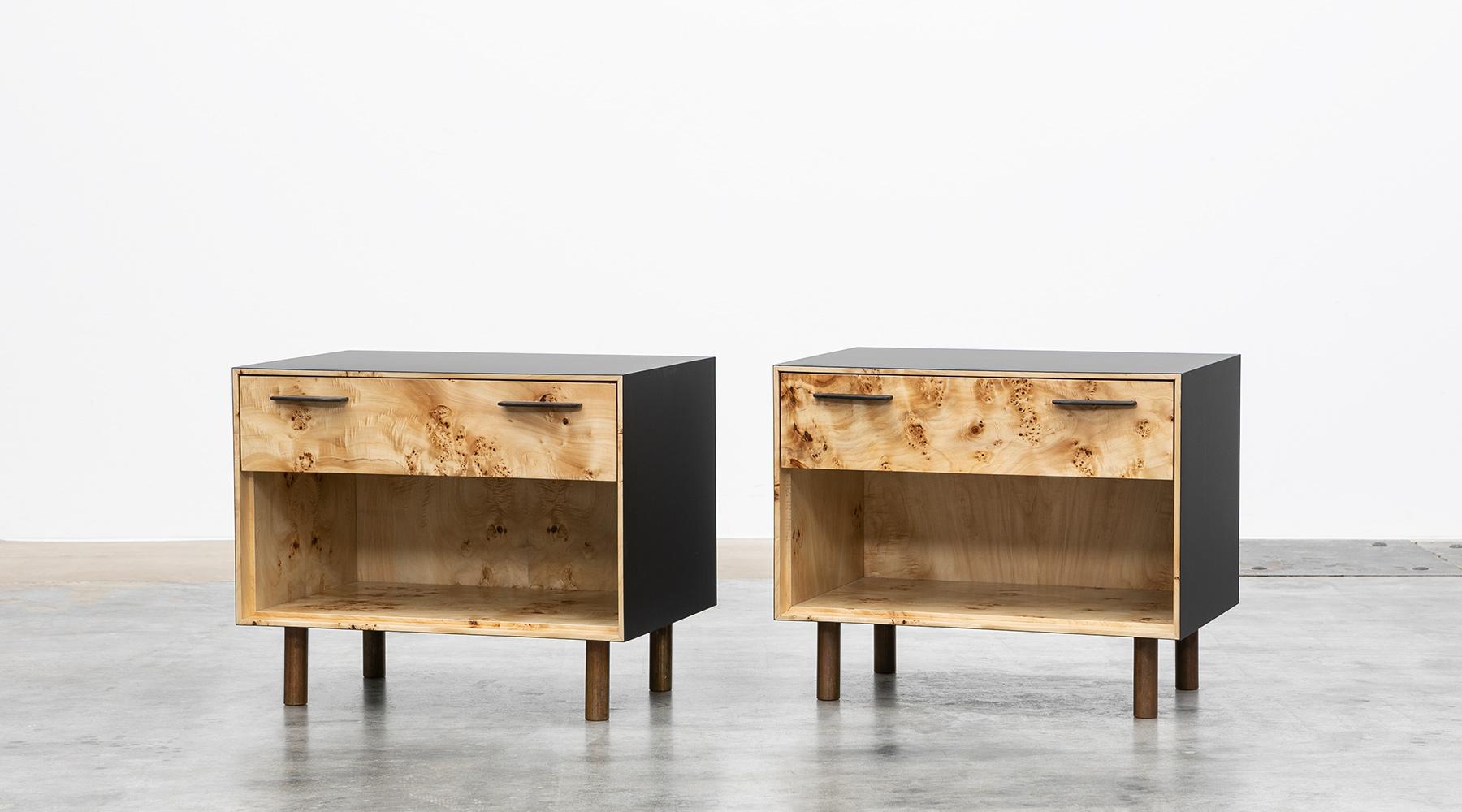 Pair of nightstands by contemporary German artist Johannes Hock, black HPL body, each case contains one drawer and stands on bronze feet. Manufactured by Atelier Johannes Hock.