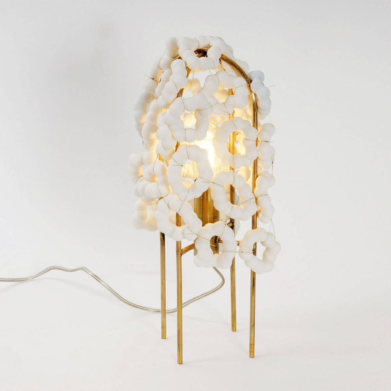 Contemporary porcelain and brass table lamp - akoya light by Johannes Hemann

Material: porcelain, brass
Light source: bulb E14, max 50 Watt
Dimensions: ø16 x H 33 cm

The Akoya table light was created by putting glue on cotton balls and