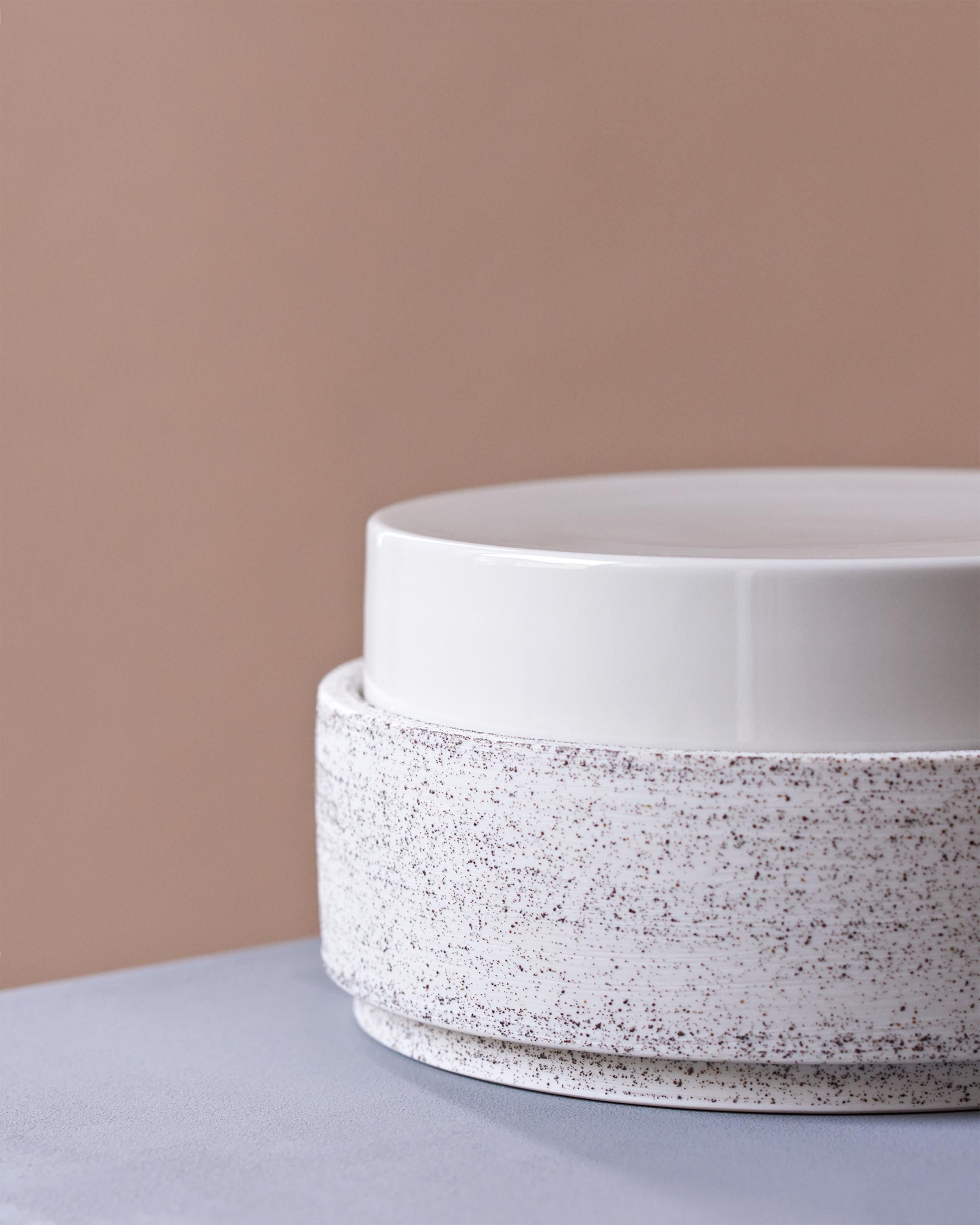This hand-thrown porcelain bowl is a contemporary and functional stand out piece. The bowl is made of volcanic sand with a glossy white porcelain lid. The bowl has a size of diameter 20.7cm, height 10 cm

The first Atlas Crafts collection is