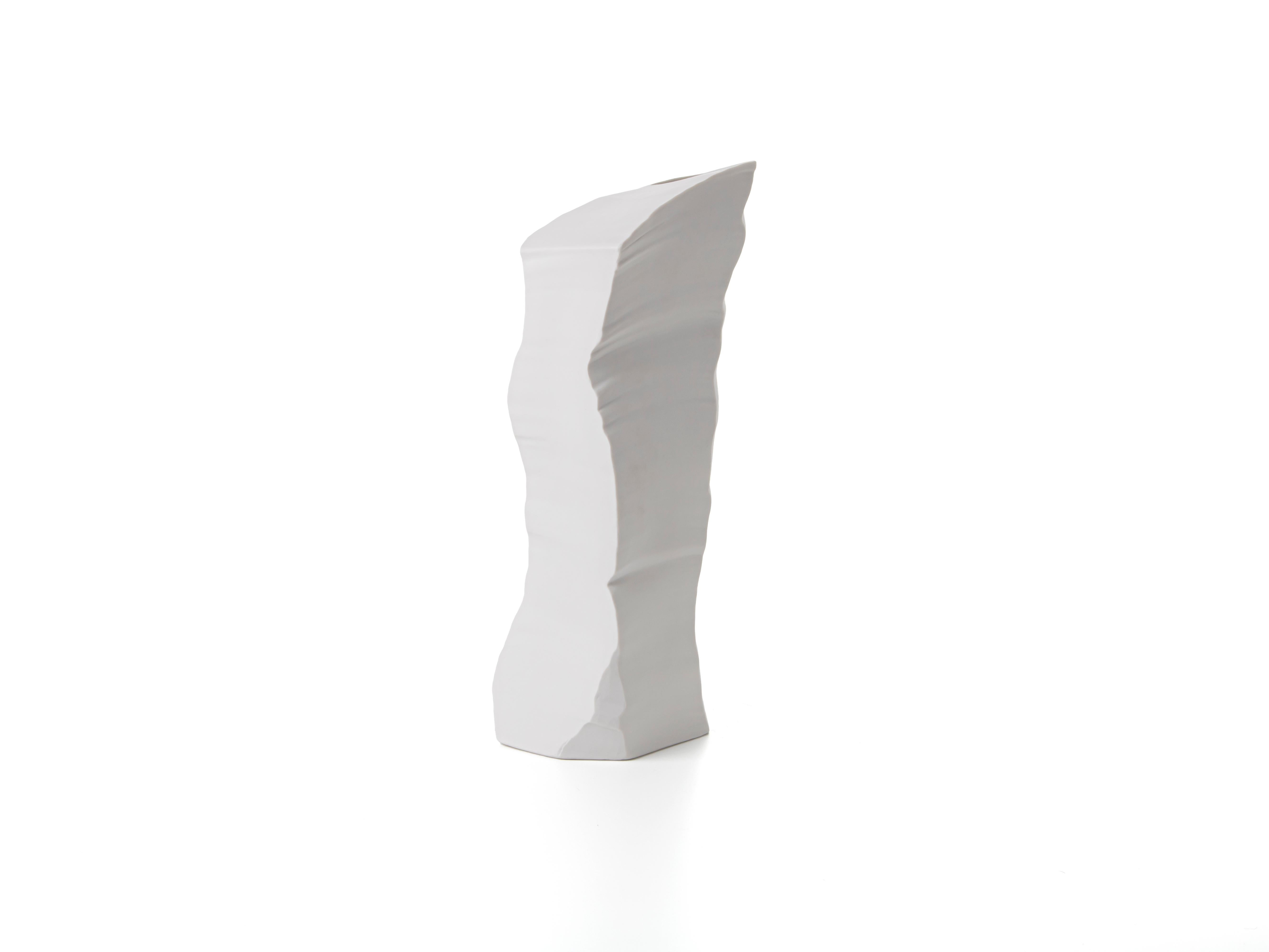 Porcelain vase / sculpture with a bold personality, part of ARTIKA collection, designed by the architect and designer Giovanni Luca Ferreri. Pure white, the signature style of FOS, changes shade every time light hits the glacier-like facets. The