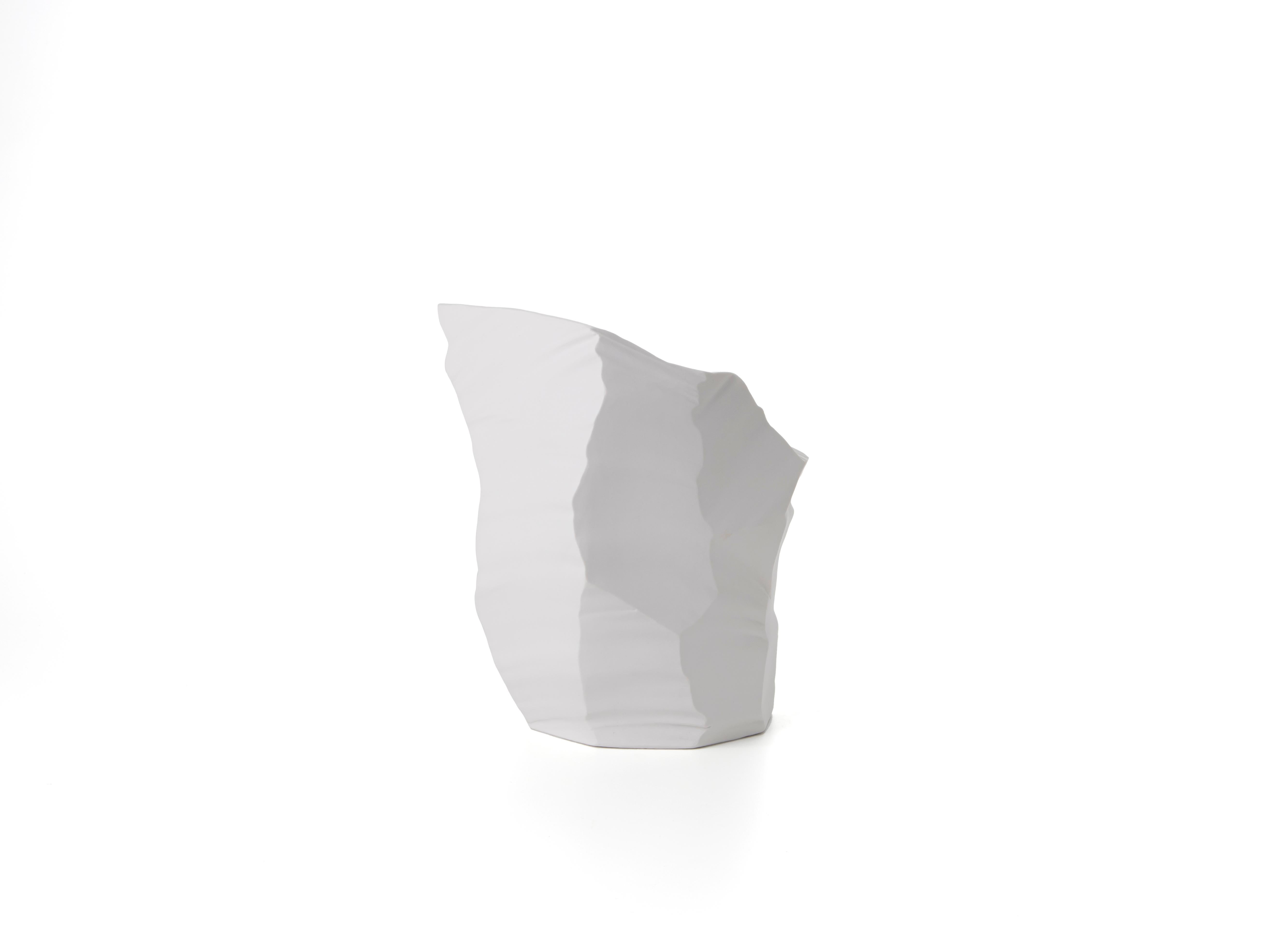 Porcelain vase / sculpture with a bold personality, part of ARTIKA collection, designed by the architect and designer Giovanni Luca Ferreri. Pure white, the signature style of FOS, changes shade every time light hits the glacier-like facets. The