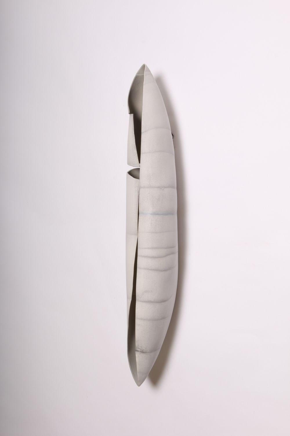 Contemporary Porcelain Wall Art / Hanging Vessel by Ceramic Artist, Paula Murray

Contemporary porcelain wall art called, 'Passages III', in the shape of a canoe, by world renowned ceramic artist, Paula Murray.
Transformation is at the heart of