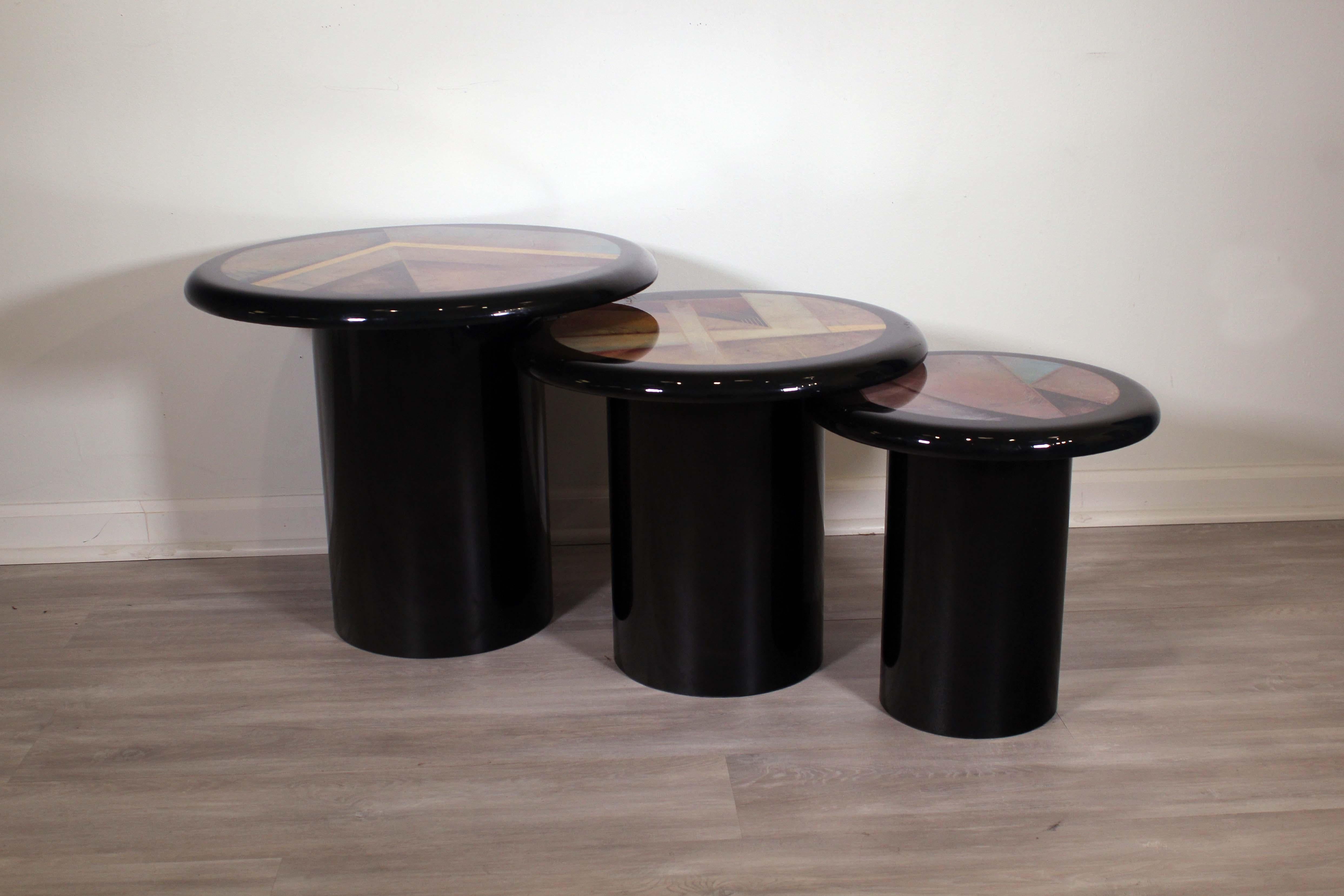This set of 3 Milano Memphis style pedestal nesting tables is sure to make a statement in your home. The tables feature an eclectic color palette with gold accents on the top adding a hint of glamour. The sleek and shiny finish makes these tables