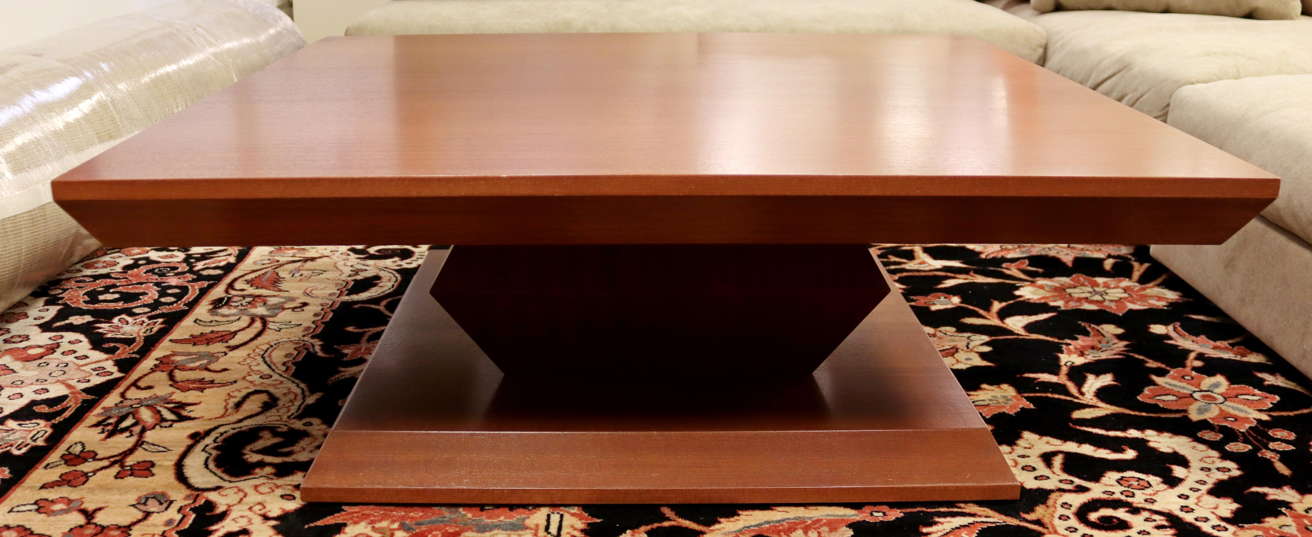 For your consideration is a special, low and square coffee table, made of African mahogany wood, by Antoine Proulx, circa the 1990s. In good condition. The dimensions are 42.25