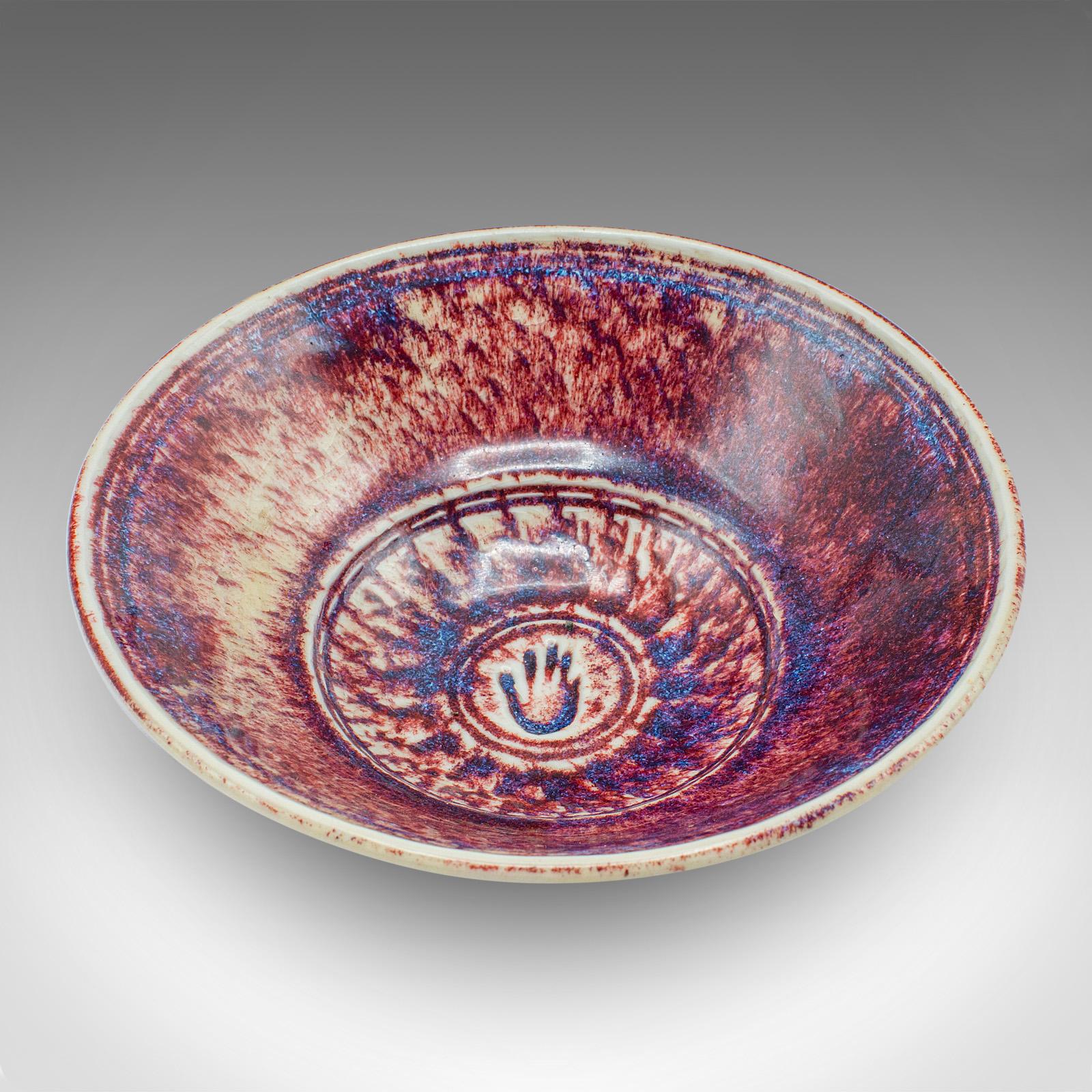 
This is a contemporary potpourri bowl. An English, ceramic serving dish by Leslie Parrott.

Fascinating appearance, with bold colour and quality finish
Displaying a desirable contemporary order throughout
Strikingly glazed bowl form, tapering to