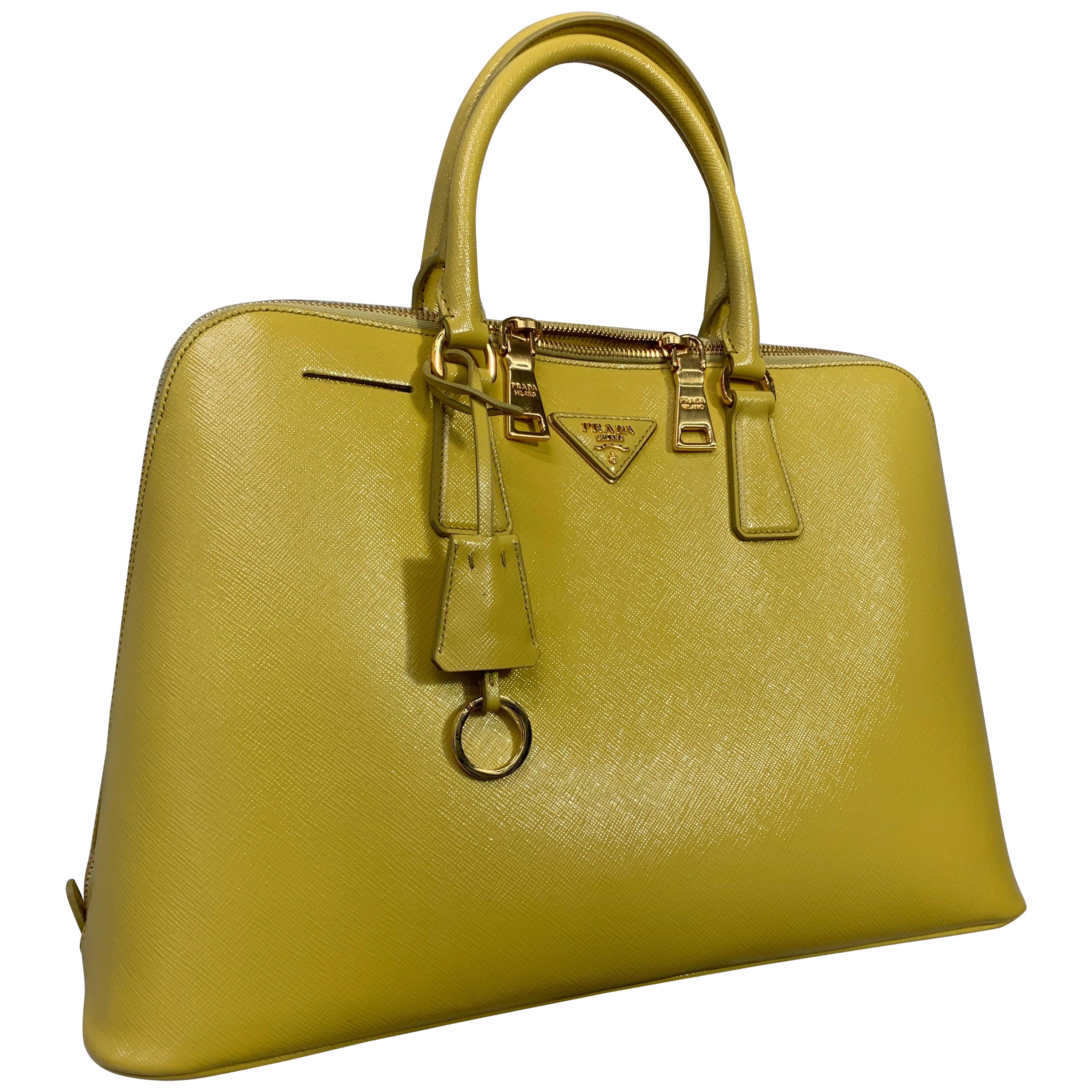 Bolsa de viaje de piel con forma de cuña de doble cara amarilla de Prada Contemporánea