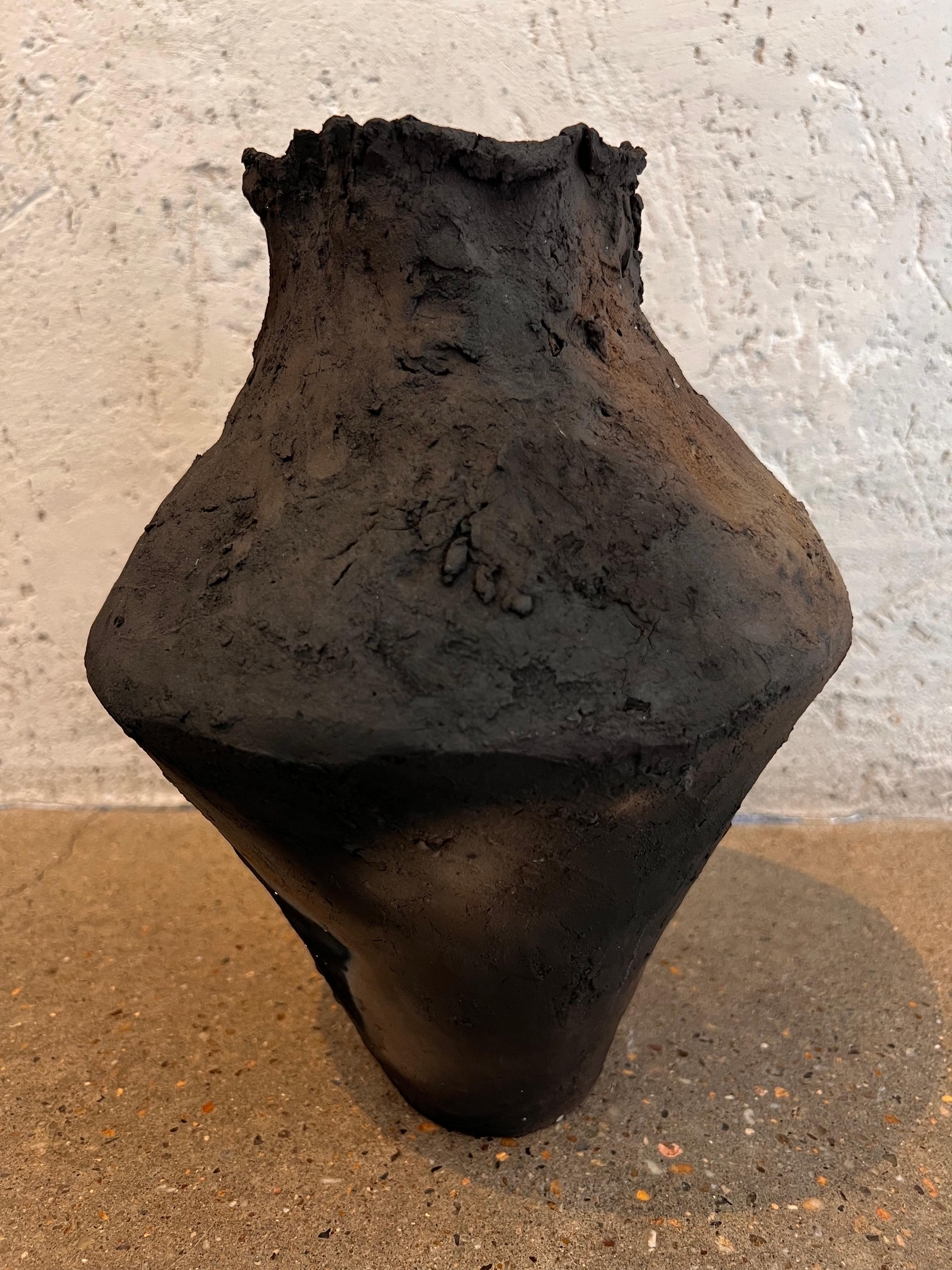 The Rustic Raw quality of the vessel is attributed to the use of hand made clay as opposed to a thrown smooth classic piece. The Primitive look gives this piece a soulful vibe.