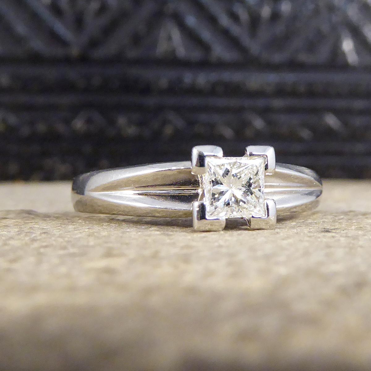 This absolutely stunning engagement ring holds a 0.45ct Princess Cut Diamond and is such a bright and clear stone. The mount has been fully crafted from Platinum, this contemporary solitaire ring shows its simplicity in the shank with corner claw